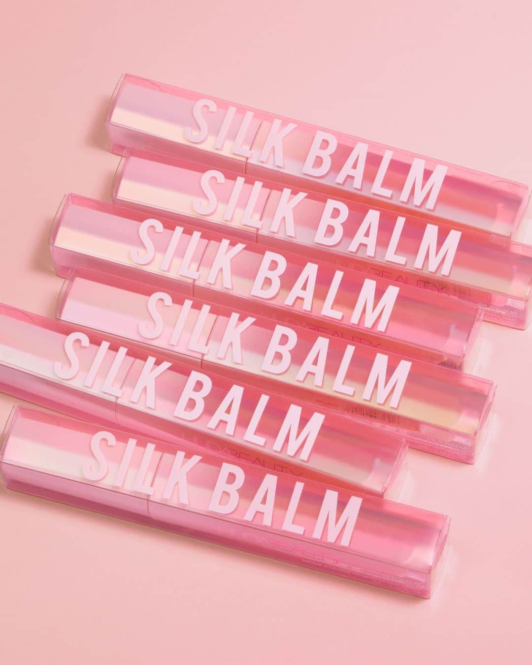 Huda Kattanさんのインスタグラム写真 - (Huda KattanInstagram)「How GORGEOUS are these babies?!! SILK BALM is available everywhere!!! 💃🏽💃🏽💃🏽 The MOST luxurious texture and hydration your lips will ever feel! The subtle blushed-pink shade looks gorgeous on everyone.  The SUPER comforting formula is infused with a blend of Hyaluronic Filling Spheres, Soybean, and Licorice Extract that work by migrating into fine lines where they swell and give a plumping effect. This action provides maximum hydration for lips that feel plumped and smooth in appearance without any tingling sensation – no pain, BIG GAIN!」6月18日 0時01分 - hudabeauty