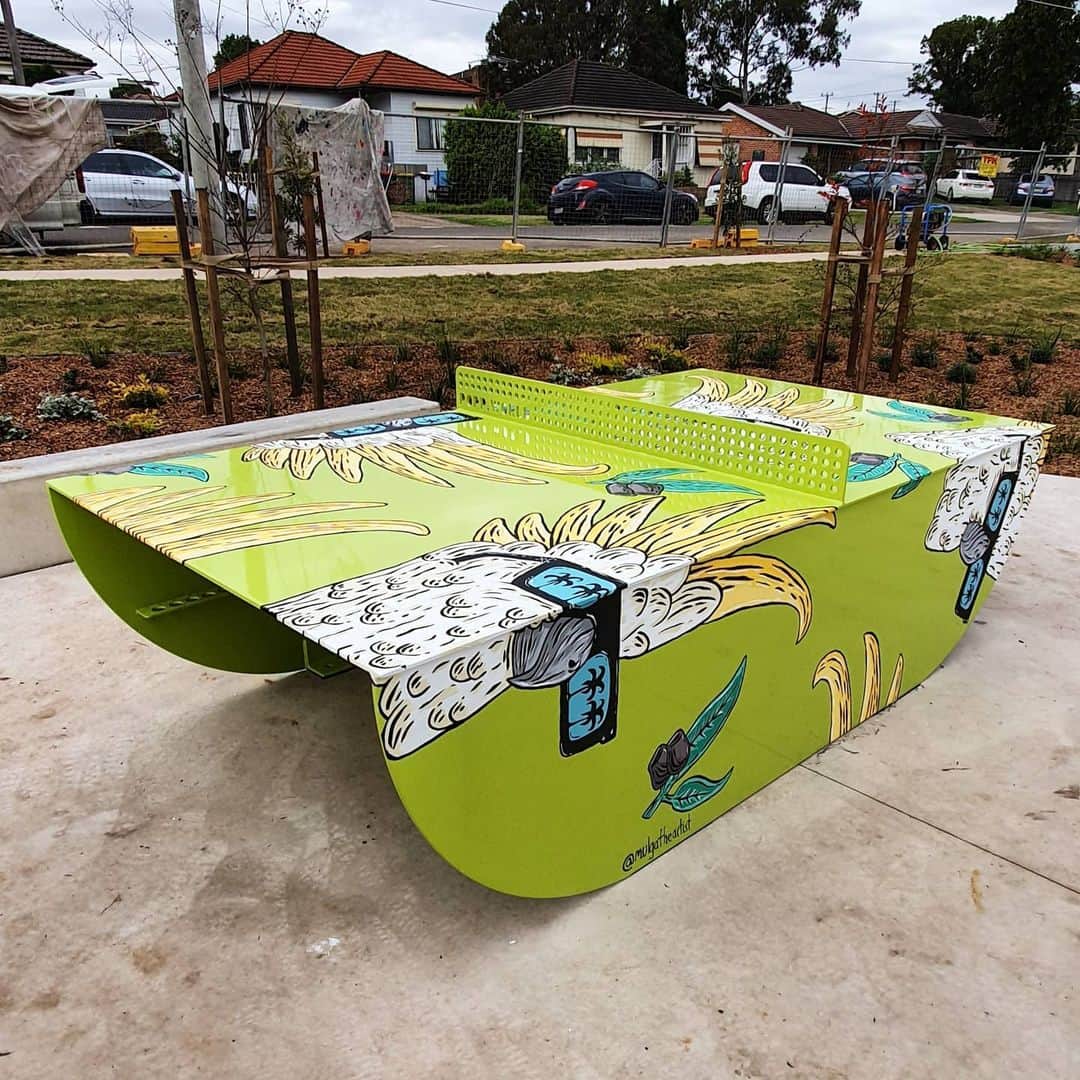 MULGAさんのインスタグラム写真 - (MULGAInstagram)「Pleased to present the Craig the Cockatoo ping pong table. Cheers to @fairfieldcity council for getting me on board and @popp.world for making a sweet table.⁣ ⁣ The newly built park where the table sits used to be 5 houses which the council purchased and then knocked down to build this sweet park. It's in Villawood on Koonoona Ave and should be open pretty soon. ⁣ ⁣ The story of Craig the Cockie⁣ ⁣ Once there was a cockie called Craig and he was a loner, flying everywhere on his own.⁣ ⁣ One day he found a piece of magical chalk on the ground and he drew a fairy. The fairy came to life and granted him one wish. He wished for a magical door. The fairy granted his wish but he didn't know where the magical door went or what would happen when he walked through it.⁣ ⁣ The Magical door seemed pretty dubious to him so tentatively he opened it and poked his head through then quickly pulled it back. The door didn't seem to go anywhere but then he looked behind him and he saw a replica of his head levitating behind him.⁣ ⁣ It was way freaky, turned out the door was a cloning device and he had just cloned his head. Then all of a sudden his head levitated itself through the door and cloned itself. The next head did the same thing and on and on it went until the whole world was made up cloned levitating Craig the Cockie heads.⁣ ⁣ Mayhem ensued and the 'Great Humans vs the Cockie Heads War' raged on for many years but was eventually settled when someone offered the Cockie Heads some gumnuts to nibble on. They seemed to like that. ⁣ ⁣ The End⁣ ⁣ #mulgatheartist #cockatoo #pingpongart #tabletennis #pingpong #cockatoodrawing」6月18日 9時00分 - mulgatheartist