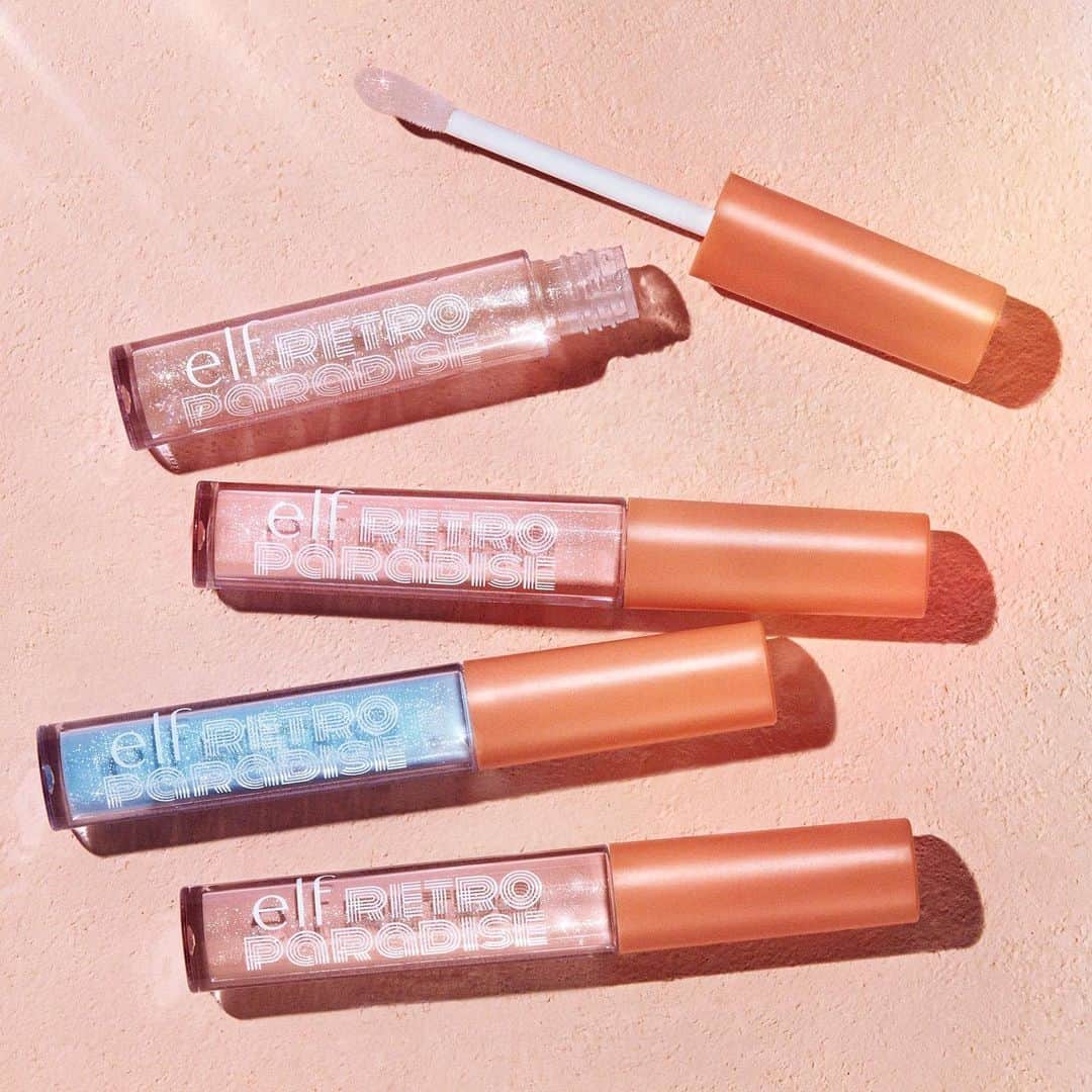e.l.f.さんのインスタグラム写真 - (e.l.f.Instagram)「What lip gloss dreams are made of 😍Give your lips a kiss of color and an irresistible tropical scent with our NEW Retro Paradise Dream On Lip Gloss!  Available in 4 delicious shades: 🤍A Moment - clear gloss with peach, pink, and gold glitter. 💗Strawberry Daquiri - nude pink gloss with iridescent pink shimmer. 💛Electric Lemonade - appears pastel blue, but applies clear with multicolor iridescent shimmer. ❤️Tropical Fruit Punch - soft peach gloss with warm gold and peach shimmer. Which shade will you be trying first? #eyeslipsface #elfingamazing #elfcosmetics #crueltyfree #vegan」6月19日 0時46分 - elfcosmetics