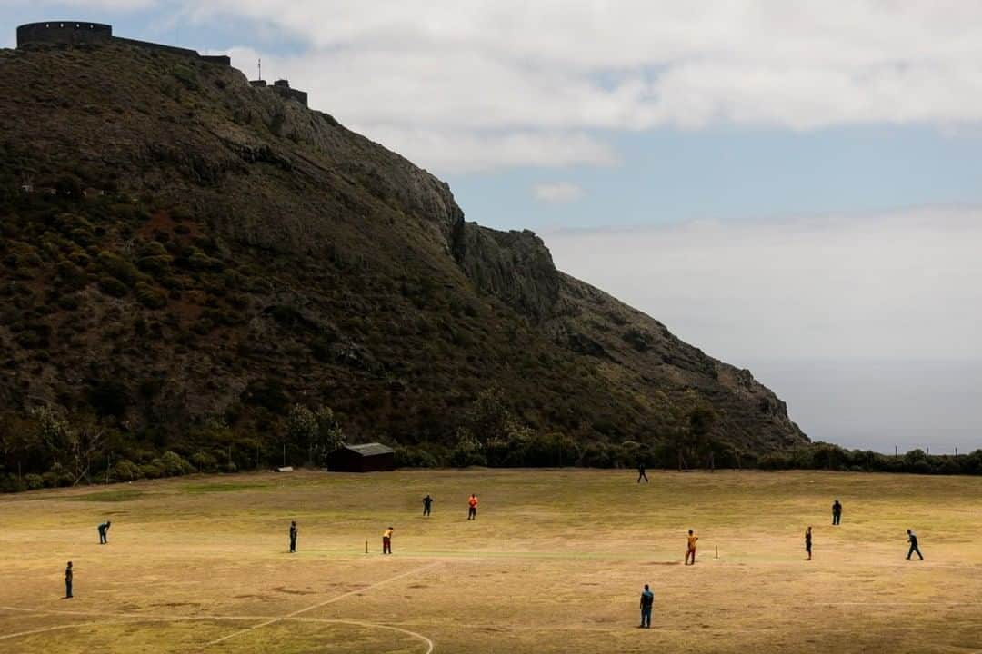 National Geographic Travelさんのインスタグラム写真 - (National Geographic TravelInstagram)「Photo by @robert_ormerod | People play a game of cricket, one of the main participating and spectator sports on the isolated island of St. Helena. The island in the South Atlantic Ocean is part of a British Overseas Territory, which also includes Ascension and Tristan da Cunha.」6月19日 13時10分 - natgeotravel