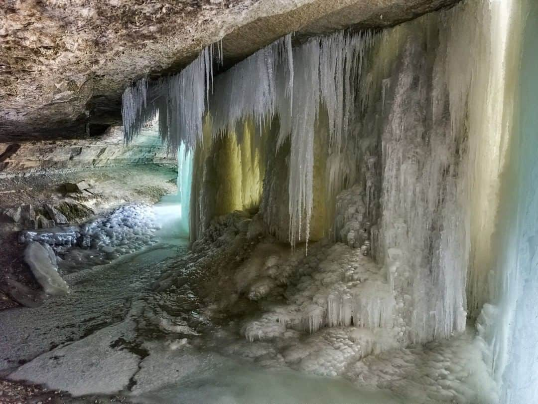 National Geographic Travelさんのインスタグラム写真 - (National Geographic TravelInstagram)「Photo by Robbie Shone @shonephoto | On a very cold day in Minnesota, the Minnehaha Falls freeze over. It's a spectacular sight as light filters through the ice. We obtained a photo permit from the authorities for our shoot; it's illegal to cross over the railings without one.」6月23日 5時05分 - natgeotravel