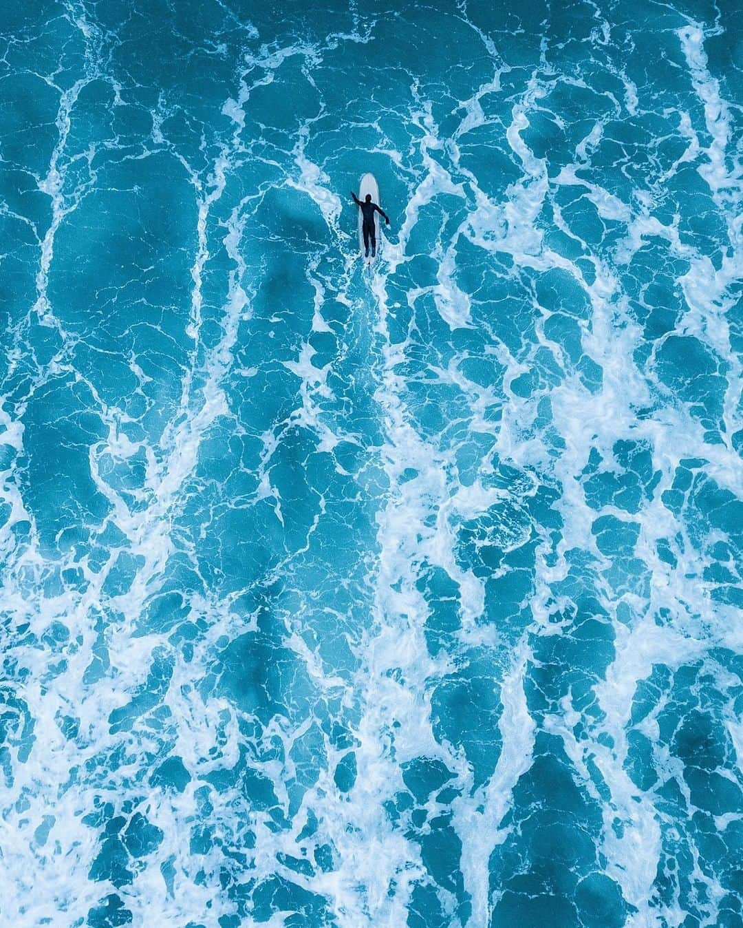 National Geographic Travelさんのインスタグラム写真 - (National Geographic TravelInstagram)「Photo by @andrea_frazzetta | Arctic surfer Lena Stoffel takes to the water off Norway’s Lofoten Islands. The small bay of Unstad has all the elements to make it a perfect place for Arctic surfing. Long, regular waves travel here uninterruptedly from Greenland. “But the really special thing is that we’re utterly alone in the water here," Stoffel says. "It’s just us, our boards, and the vastness of nature all around us.” To see more photos from my travels, follow me @andrea_frazzetta. #arcticsurf #lofoten #norway」6月23日 9時04分 - natgeotravel