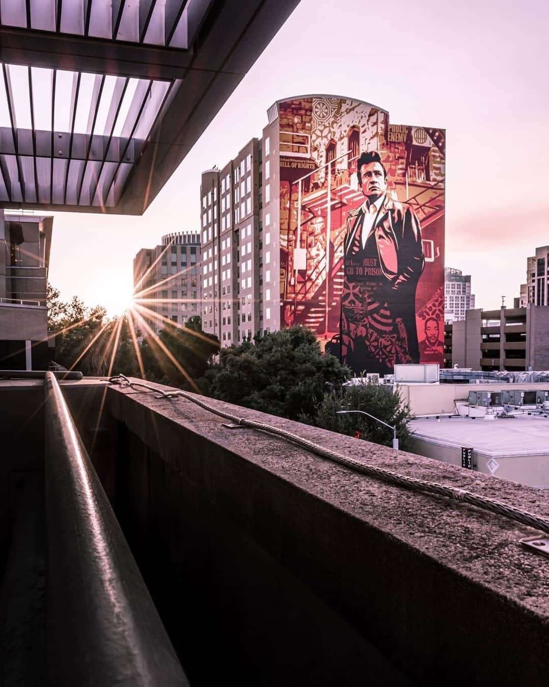 Shepard Faireyのインスタグラム：「Thank you @mattfraser9 for this great shot! My team and I completed this 15-story Johnny Cash at Folsom Prison mural for @wideopenwalls in 2018, which is my largest mural in California. The art is based on a photo by Jim Marshall, which I used originally as part of my American Civics series. I hope that this mural has continued to ignite a conversation around the need for incarceration reform.⁠ ⠀⠀⠀⠀⠀⠀⠀⠀⠀⁣ According to a recent in-depth study by the Prison Policy Initiative, America has the highest incarceration rate in the world with a shocking 2.3 million people currently imprisoned. On top of that, our prisons are disproportionately filled with people of color, in fact, African Americans are 13% of the U.S. population, yet 40% of the prison population in this country. More African American men are under correctional control today than there were slaves in the 1850's, according to a Huffington Post piece by writer and civil rights advocate Michelle Alexander. You can read more about this on my blog post from 2018 with updated 2020 stats from prisonpolicy.org (link in bio). Let’s continue to educate ourselves and take action. Thanks for caring.⁠ -Shepard」