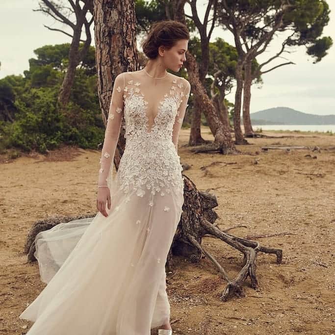LAVIEEN ROSE Weddingのインスタグラム：「Romantic & Mode… 　femininity ﻿﻿♡" ﻿﻿ シアーな素材と大胆なイリュージョンネックライン。 クラシックなAラインのシルエットで、おとぎ話の世界を彷彿とさせるフレンチチュールガウン。 ﻿﻿ ﻿﻿ #costarellos / コスタレロス﻿🌿﻿﻿ ﻿﻿﻿﻿ ﻿ ” Galene ” ﻿﻿﻿﻿﻿ ﻿ ﻿﻿#costarellosDREAMERS ﻿﻿﻿ ﻿﻿ #costarellosbrides ﻿ ﻿﻿ ﻿﻿ Marrying sheer fabric and a daring neckline with a classic A-line silhouette, this ethereal French tulle gown is straight out of a fairytale.  A multitude of intricate floral lace appliqués sculpt the bodice and adorn the sheer sleeves creating a second-skin effect.  Subtle shine glimmers from the bodice’s sequin detail as wispy layers of French tulle float down to a sweeping hem.  The back turns to reveal an array of floating covered buttons slowly vanishing as a myriad of tiny florals dance across the back of the gown. ﻿﻿﻿﻿﻿ ﻿﻿﻿﻿ ﻿﻿﻿#ラビアンローゼ﻿﻿ #インポートドレス #インポートドレスショップ #ウェディングドレスレンタル #ナチュラルウェディング#2020秋婚 #大人花嫁 #全国の花嫁さんと繋がりたい #プレ花嫁さんと繋がりたい#プレ花嫁 #hawaiiwedding #卒花嫁 #結婚式 #結婚準備 #2020夏婚#weddingphotography #ドレス試着 #weddingphoto #ガーデンウェディング #ウエディングドレス #ハワイ #レストランウェディング #2020秋婚 #海外ウェディング #国内パーティー﻿﻿ #ナチュラルウェディングドレス #ナイトウェディング ﻿﻿﻿﻿ ﻿﻿﻿﻿﻿ ﻿﻿﻿ ﻿﻿﻿ ﻿﻿﻿﻿ ﻿ ﻿ ﻿﻿﻿ ﻿ ﻿ ﻿﻿ ﻿ ﻿」
