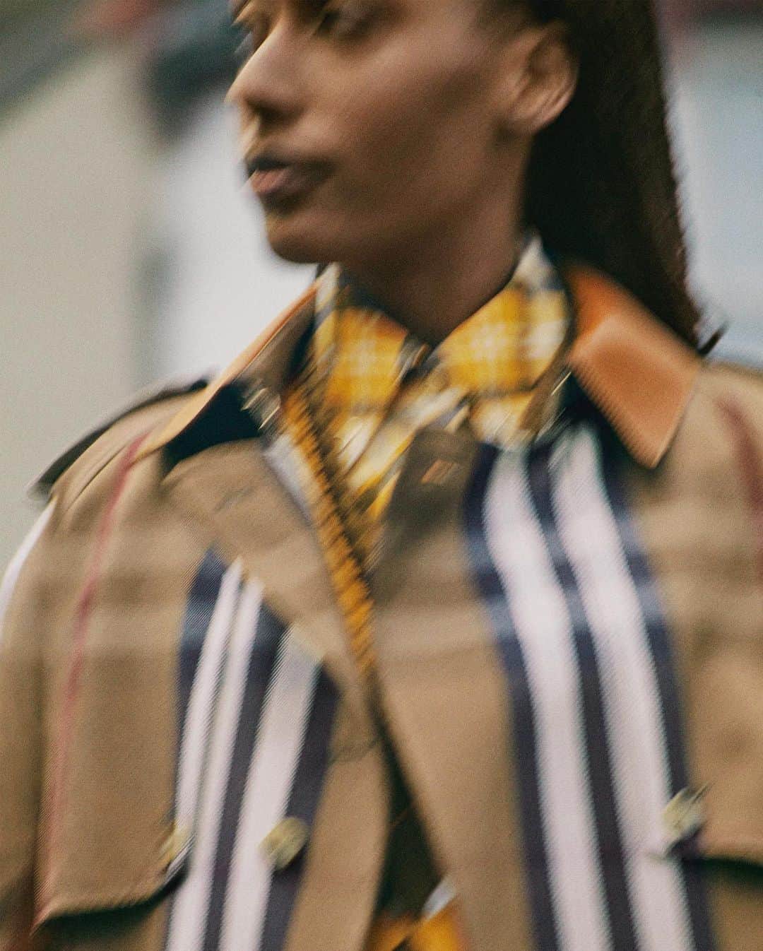 Burberryさんのインスタグラム写真 - (BurberryInstagram)「Tanisha, Copy & Translations, East London . ‘For the lookbook, I called upon the incredible talent at Burberry to open their doors and be a part of this journey – each interpreting the looks in their own unique way outside in the landscapes of London and beyond.’ - #RiccardoTisci . Tanisha wears a birch brown check trench with a bright orange cut-out argyle jacquard vest, plaid shirt and pencil skirt from the upcoming collection, arriving in November .  #BurberryPreSS21」7月23日 20時22分 - burberry