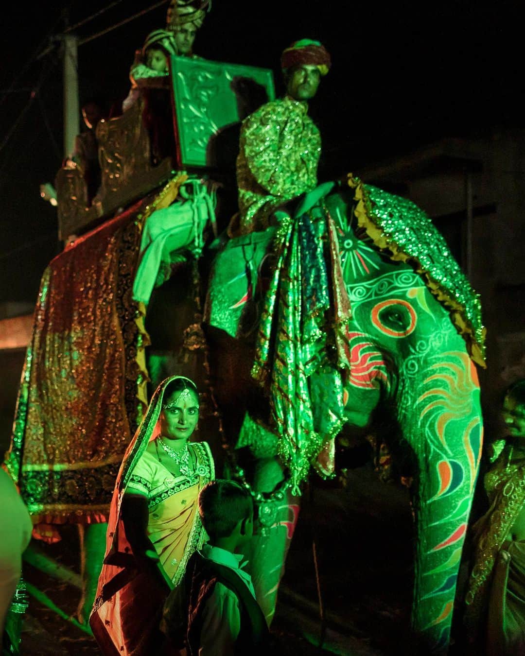 ジョン・スタンメイヤーさんのインスタグラム写真 - (ジョン・スタンメイヤーInstagram)「Swipe ~ A groom is carried to his wedding on the back of an elephant draped in colorful fabrics and surrounded by dancing celebrants in Singhana, Rajasthan, traveling the street at night that leads between Jaipur to Delhi. Often elaborate affairs, thousands of marriage ceremonies take place across northern India during the wedding season from September until February. Wedding dates and times in Hindu communities are suggested by astrologers. ⠀⠀⠀⠀⠀⠀⠀⠀ Our second of three Zoom panel discussions is full tomorrow (Thursday) but you can still watch the livestream on @natgeo and @outofedenwalk’s Facebook pages! Join Paul Salopek, @pri_borpujari, @aratikumarrao, @dreamersid, @camillaferrariphoto and I, tomorrow, July 23rd. We will be sharing stories, videos and photography from our walk across north India and water crisis facing the second most populated nation on earth. It all begins 10:00 am EST, 16:00 CET and 7:30 pm IST. See you tomorrow ❤️ ⠀⠀⠀⠀⠀⠀⠀⠀ #edenwalk #paulsalopek #india #northindia #rajasthan #elephant #wedding #walkingindia @natgeo @outofedenwalk」7月23日 12時50分 - johnstanmeyer