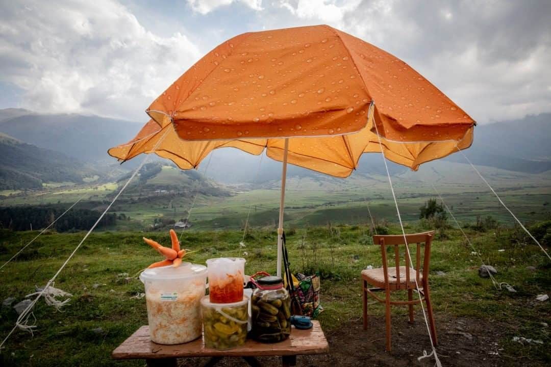 National Geographic Travelさんのインスタグラム写真 - (National Geographic TravelInstagram)「Photo by @anushbabajanyan  An umbrella covers pickled cabbage, cucumbers, and carrots made and sold by the ethnically Russian Molokans of Fioletovo. #Armenia #meghri」7月19日 17時08分 - natgeotravel