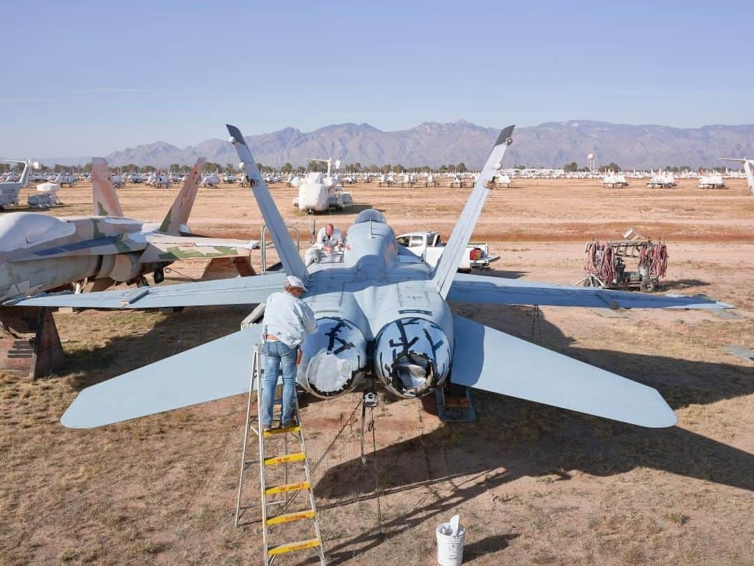 ナショナルジオグラフィックさんのインスタグラム写真 - (ナショナルジオグラフィックInstagram)「Photo by @lucalocatelliphoto  A fighter jet is prepared for latex spraying at an Air Force base in Tucson, Arizona. This technique is used to preserve the planes from corrosion—after engines and other delicate parts are masked with foil, the plane is sprayed with a mixture that, once dry, transforms into a protective barrier against the elements.  The process to optimize the life cycle of such resource-intensive machines is a leading example of the "circular economy" in the heavy-industry sector. The so-called Boneyard remanufacturing technology makes the most out of the planes that sit at the airfield. Precious parts are dismantled and reused in the Air Force, and entire aircraft can be reassembled and put back into service. At the end of the life cycle, they can be scrapped for steel and aluminum recycling.   This image is part March cover story "The End of Trash" in National Geographic magazine. Please follow me @lucalocatelliphoto to find out more and discover other stories about the environment. #airplanes #usa #recycling #environment #lucalocatelliphoto  Check out Nat Geo's link in bio for more on this story.」7月20日 23時37分 - natgeo