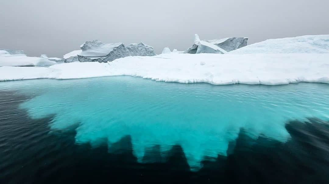 National Geographic Travelさんのインスタグラム写真 - (National Geographic TravelInstagram)「Photo by @daisygilardini  I always carry a few filters in my day pack: a circular polarizer, a graduated gray, and a few neutral-density filters. Because the air is so dry in the polar regions, using a polarizer against a blue sky can be dangerous since it may turn your dark blue into a pure black. Some people like it, but I don’t. I often use a filter, however, when Zodiac cruising among icebergs, like here in Scoresby Sound, Greenland. This helps cut the glare from the water, giving me a deeper view into the part of the iceberg that lies under the blue waterline. Follow me @DaisyGilardini for more images and stories behind the scenes. #greenland #scoresbysund #iceberg #climatechange」7月21日 1時07分 - natgeotravel