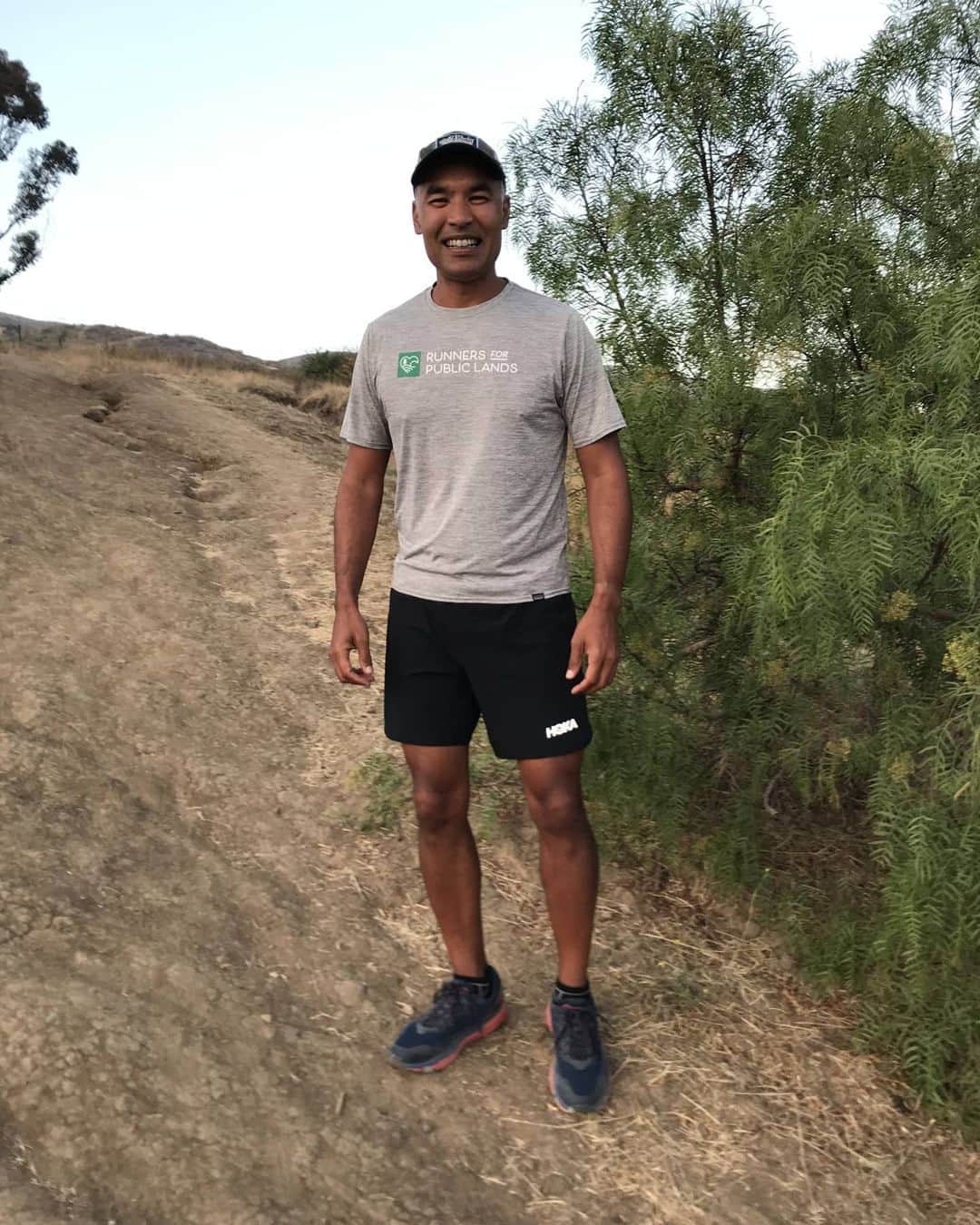 ホカオネオネのインスタグラム：「“I grew up in Fresno, CA, not far from Woodward Park, a wondrous, 300-acre regional park and bird sanctuary with a lake, ponds, hills and trails. By high school, it was my favorite place to be. For just a park, it was a runner’s dream. I started running on my own there as a teenager, enjoying the trees, especially with the mountains in the background. I loved the freedom of running wild, up and down hills, and through the streams. Those are my happiest memories.  Running feels elemental to me, closer to being the human animals we are, being animated. I believe runners have a special connection to the living natural world. Not, of course, at the level of connection of those whose livelihoods directly connect to the environment, but perhaps, potentially, toward that level. The more I learn about the natural world, the deeper the connection. A couple facts are compelling to me: runners are the largest outdoor recreational group in the country and are out doing their sport more frequently than any other outdoor recreational group; and our environment urgently needs both protection and restoration.   I was inspired to start Runners for Public Lands, because I wanted to help to realize the unprecedented potential of millions of runners contributing to, and exercising leadership, in the areas of climate action; environmental sustainability; the protection and restoration of public lands; and safe and equitable access to parks and trails.  I’m passionate about building a national environmental organization that helps turn every runner into a better steward of the environment. Every day I try to do a little bit, some days it’s a lot, to make that dream a reality, to see generations of runners become environmentalists.” - Vic Thasiah, founder of @runners4publiclands, on why he runs and what motivated him to start Runners for Public Lands. #timetofly #HumansofHOKA」