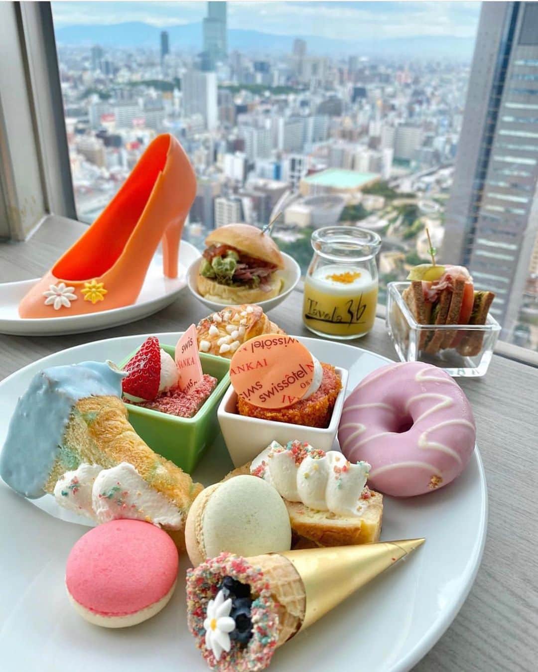 スイスホテル南海大阪さんのインスタグラム写真 - (スイスホテル南海大阪Instagram)「#フライデーファンフィーチャー：都会の景色に架かるスイーツの虹。@myk_foodsweets さん、「タボラ３６」のパステルスイーツブッフェでの一コマをご投稿いただきありがとうございます。スイスホテル南海大阪で撮影した写真を#LiveItWellOsaka #洗練された時 のハッシュタグをつけてご投稿ください！毎週金曜日にあなたの自慢の#洗練された時をご紹介します。スイスホテル南海大阪 #スイスホテル　   #FridayFanFeature: Rainbow views amidst the cityscape. Thank you @myk_foodsweets for sharing your experience at the Tavola36 Pastel Sweet Buffet! Have any photos of the Swissôtel Nankai Osaka? Tag us #LiveItWellOsaka for a chance to be featured!」7月3日 15時03分 - swissotelnankaiosaka_official