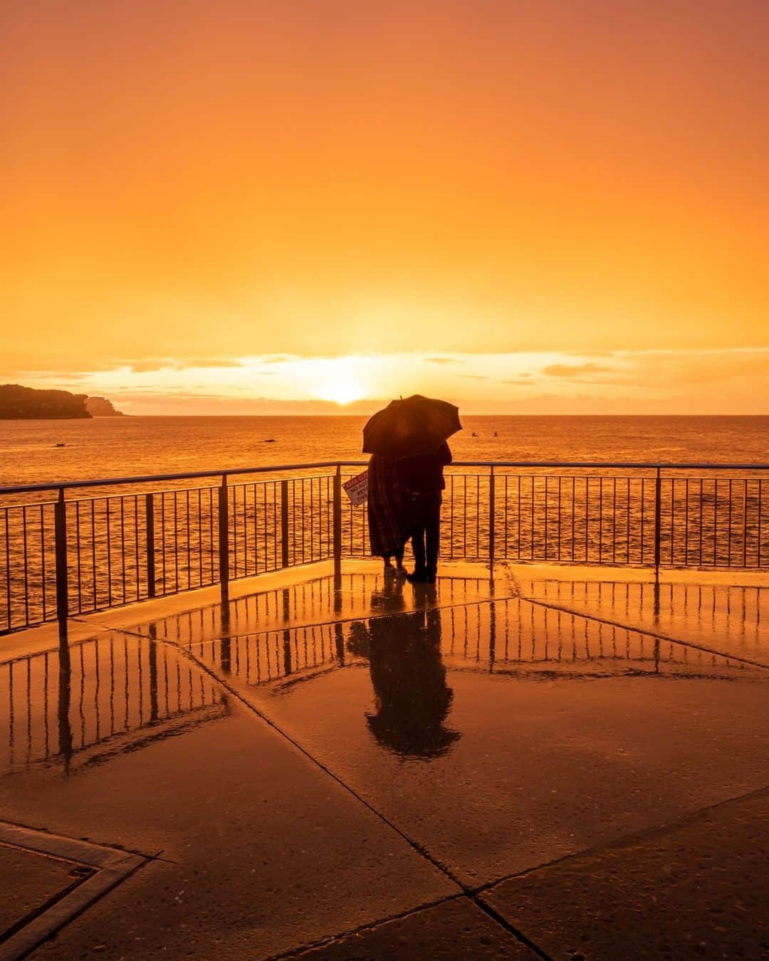 Nikon Australiaさんのインスタグラム写真 - (Nikon AustraliaInstagram)「"There was an incredible pop of colour as the sun popped over the horizon, even though it was pouring down with rain, I had to leg it back from the car to capture it. Given the rain, this couple ended up with the beach mostly to themselves. What a view!" - @nikkibings⁣ ⁣ Camera: Nikon Z 7⁣ Lens: NIKKOR Z 14-30mm f/4 S⁣ Settings: 23mm  f/8  1/20s  ISO 200⁣ ⁣ #Nikon #MyNikonLife #NikonAustralia #NikonZ7 #Z7 #Sunrise」7月3日 15時15分 - nikonaustralia