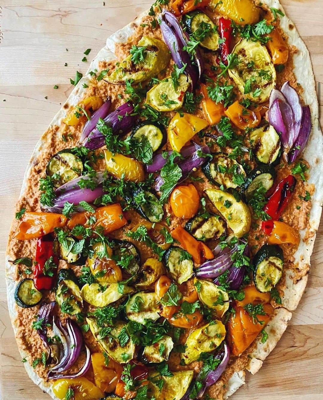 Food & Wineさんのインスタグラム写真 - (Food & WineInstagram)「This veggie masterpiece doesn't just turn heads; it's also packed with make-ahead options and smart shortcuts. Tap the link in our bio to make this grilled vegetable flatbread with smoked almond muhammara, like Editorial Assistant @antarasinha did.」7月4日 23時31分 - foodandwine