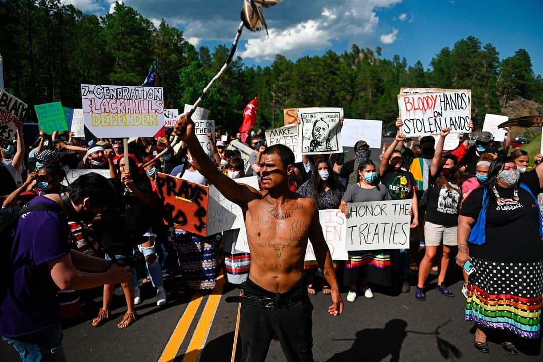 TIME Magazineさんのインスタグラム写真 - (TIME MagazineInstagram)「In divisive remarks before a big, mostly maskless crowd at the Mount Rushmore National Memorial in South Dakota on July 3, President Trump accused protesters demanding racial justice of a "merciless campaign to wipe out our history," the Associated Press reports. "The president offered a discordant tone to an electorate battered by a pandemic and seared by the recent high-profile killings of Black people. He zeroed in on the desecration by some demonstrators of monuments and statues across the country that honor those who have benefited from slavery, including some past presidents." In these photographs: Marine One, carrying Trump, flies past Mount Rushmore; an attendee dressed as President Abraham Lincoln; activists and members of different tribes from the region block the road to Mount Rushmore during a protest against the monument; the President and First Lady Melania Trump arrive onstage; Trump is projected onscreen during his remarks; and the President looks up at fireworks. Read more at the link in bio. Photographs by @al_drago—Bloomberg/@gettyimages, @andrewcr1—@afpphoto/@gettyimages, @saulloeb—@afpphoto/@gettyimages and @tom_brenner—@reuters」7月5日 6時55分 - time