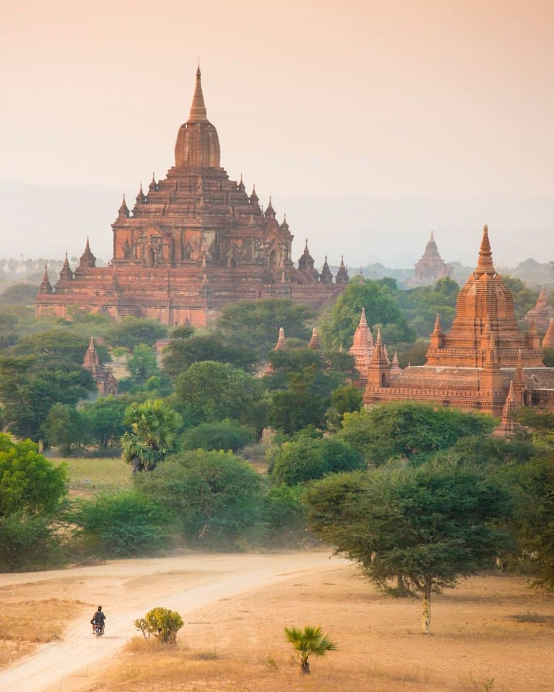 National Geographic Travelさんのインスタグラム写真 - (National Geographic TravelInstagram)「Photo by @emilypolar  The heat of the sun subsides for the day in the dry and dusty planes of Bagan. It is a perfect time to take the bike out or go for a walk. Maybe it’s just me, but there’s something about the ambient light of dusk, especially when it’s warm outside; a sense of aliveness comes about. It’s almost like feeling the quality of the light.  To see more of the magnificence in the mundane, follow me @emilypolar. #Bagan #Burma #Myanmar」7月5日 13時09分 - natgeotravel