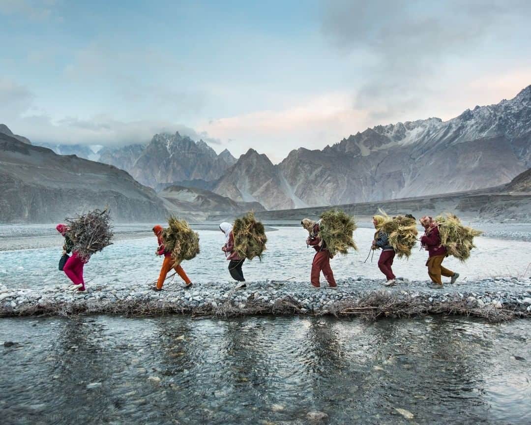 National Geographic Travelさんのインスタグラム写真 - (National Geographic TravelInstagram)「Photo by Matthieu Paley @paleyphoto I Under the gaze of the Karakoram Range, a group of women, members of the Wakhi ethnic group, return from a daily excursion across Pakistan’s Hunza riverbed to gather fodder and wood for their cooking fires. The daily trip takes about two hours on foot between their village and their pastures. For more cultural encounters, visit @paleyphoto. #pakistan #karakoram #wakhi」7月5日 17時08分 - natgeotravel