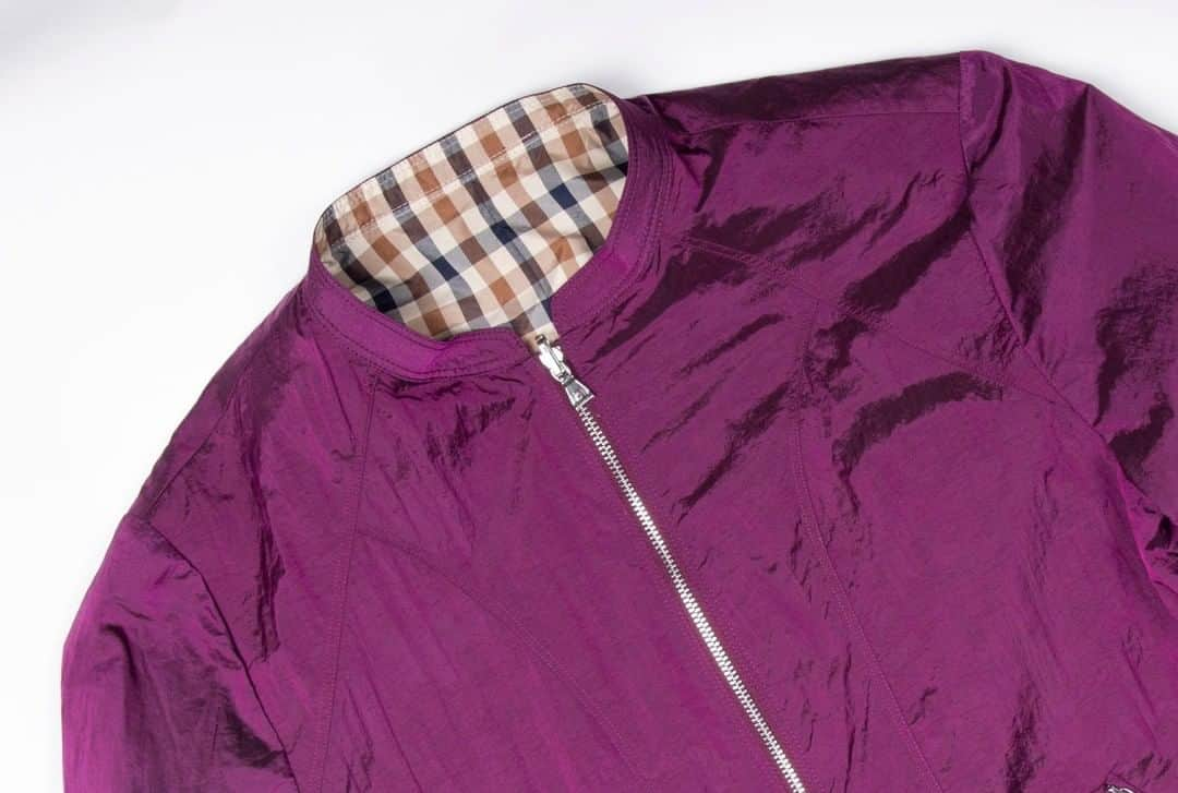 アクアスキュータムのインスタグラム：「The Nora maintains a strong #Aquascutum aesthetic, but with a softer more feminine side. This short reversible blouson is perennially chic & lined with our signature club check. Our design team used an Italian textured light weight fabric with a short-effect weave to create this statement-making blouson in a rich fuchsia colour.」