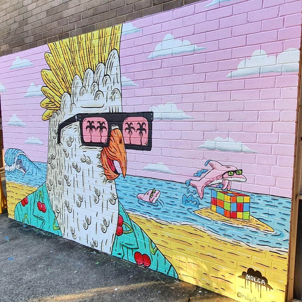MULGAさんのインスタグラム写真 - (MULGAInstagram)「Cherry the Chiller Cockie mural at @southsydneyhsofficial. ⁣ ⁣ Thanks @tint.paint for the colours and Rob and the crew at school for having me down for a paint and helping me paint.⁣ ⁣ The story of Cherry the Chiller Cockie⁣ ⁣ Once there was a Cockatoo called Cherry the Chiller Cockie because cherries were his favourite food and he was a mad chiller. He loved wearing his cherry themed Hawaiian style shirts and he had 7 cherry themed shirts for everyday of the week and if you ever bumped into him down at Maroubra Beach you were guaranteed to catch him chilling whilst wearing a cherry themed Hawaiian style shirt and maybe nibbling on a Cherry Ripe chocolate bar. Sometimes he went surfing in his cherry themed Hawaiian style shirt, adding much colour and flair to the line up. That's the story of Cherry the Chiller Cockie.⁣ ⁣ The End⁣ ⁣ #mulgatheartist #muralart #schoolmural #sydneystreetart #cockatoo #cockatooart #australianart #rubixcube #maroubrabeach」7月7日 12時04分 - mulgatheartist