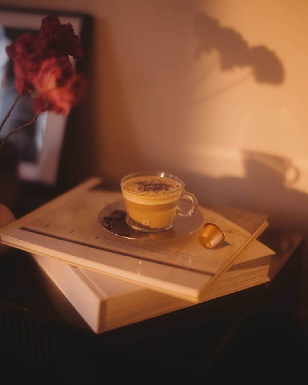 Nespressoさんのインスタグラム写真 - (NespressoInstagram)「Long afternoons of lounging hold merit too. And on #WorldChocolateDay, let’s indulge in a little sweet treat when we drink our coffee.  Add a sneaky dash of chocolate to your cup, or if you’re feeling bold why not try one of our dark chocolate squares with caramel? Let's watch the shadows grow as the sun makes its daily journey toward the horizon, with a satisfying combination of coffee and chocolate close by.🍫☕️✨  📷: @virgile.guinard  #NespressoMoments #SummerWithNespresso #ElevateYourSummer #SummerAtHome #CoffeeLover  Note: Product as sold does not contain any milk ingredients」7月7日 18時03分 - nespresso