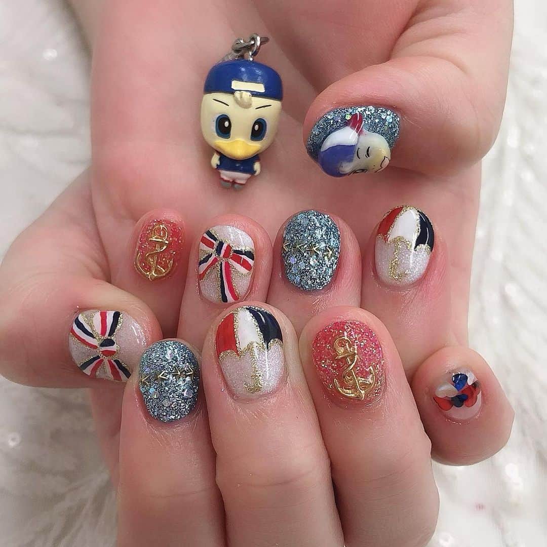 山口みらんのインスタグラム：「New nails 💅💗 . 3Dで作ってもらったマリノスケ🔴⚪️🔵 . トリコロールのリボン🎀 . トリパラのイラスト⛱ 、 4つの星⭐️⭐️⭐️⭐️ . 碇のパーツ⚓ . とことんマリノスに凝りました\(*°∀°*)/Jリーグ再開が嬉しくて夏ってトリコロールの色が似合う⚪️🔴🔵 、 #fmarinos #nail #マリノスネイル #jリーグ #jサポ女子 #マリノス #トリコロール #トリコロールネイル #トリパラ #横浜 #サッカー」
