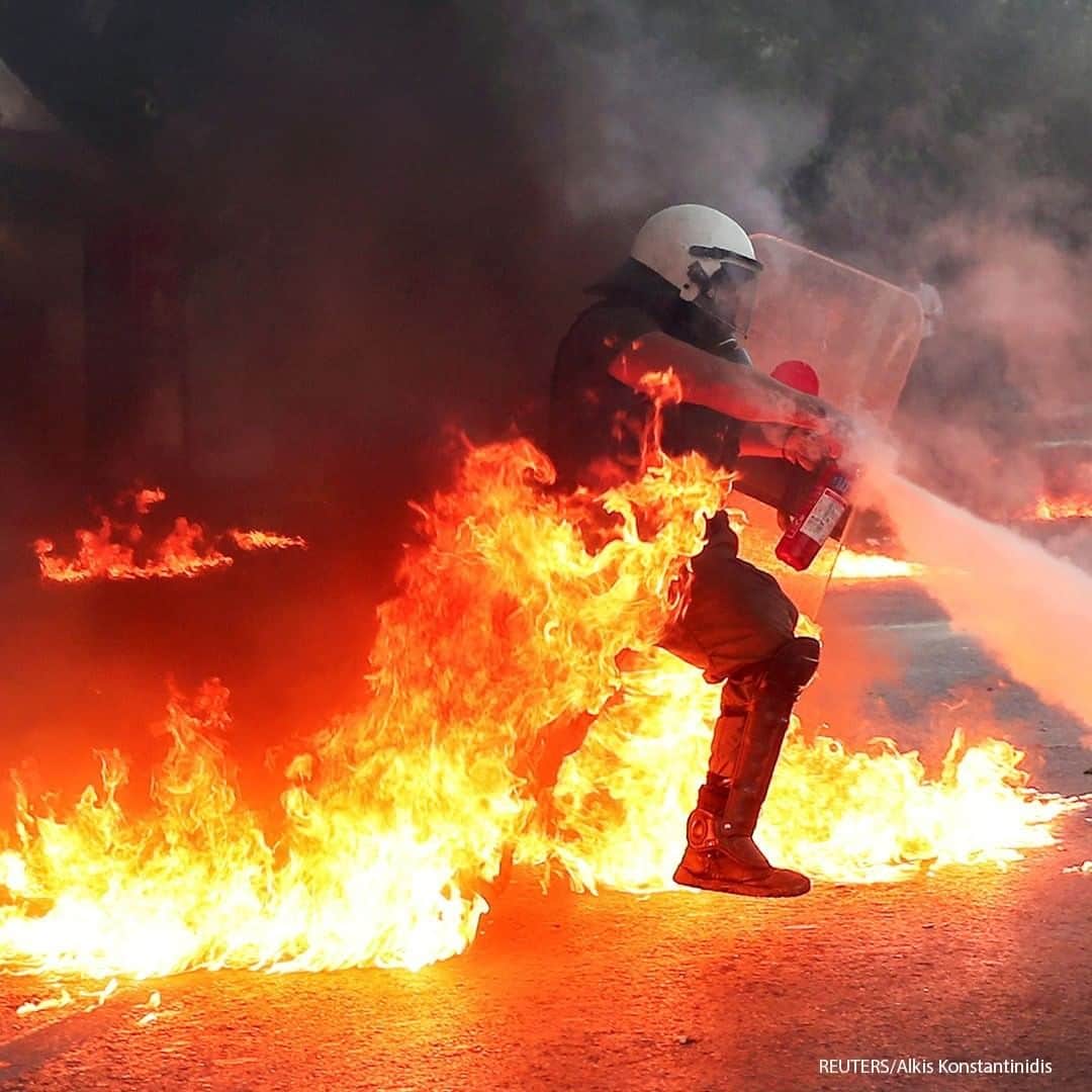 ABC Newsさんのインスタグラム写真 - (ABC NewsInstagram)「A riot police officer extinguishes a fire during a demonstration against government plans to regulate street protests, in front of the parliament building in Athens, Greece. #greece #athens #protest」7月10日 18時30分 - abcnews