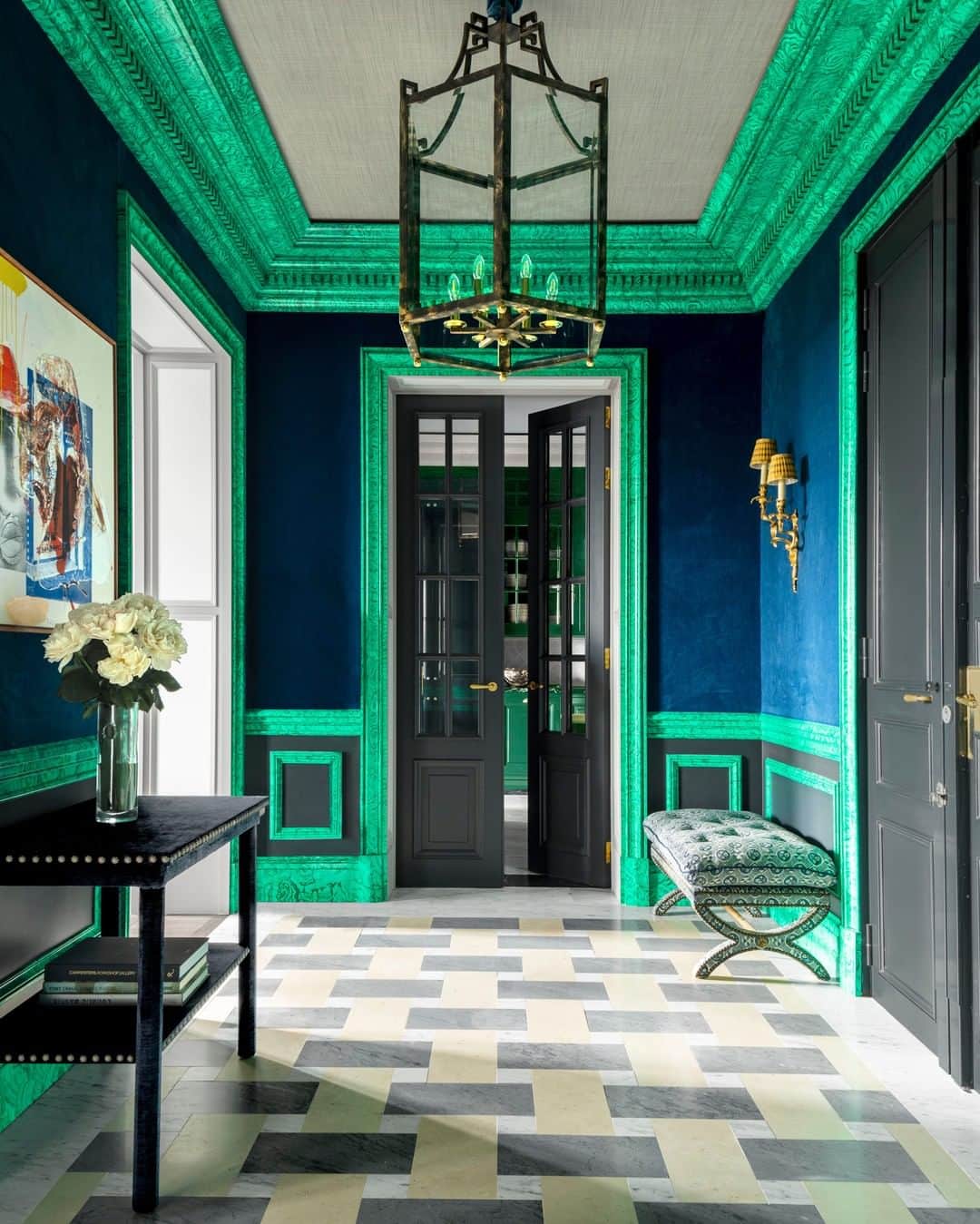 ELLE DECORさんのインスタグラム写真 - (ELLE DECORInstagram)「This entryway in a Paris apartment, designed by @lorenzocastillofe, was hand-painted by Seville's La Coloreria artisans to create a faux-malachite finish on the moldings and doorframes. The home, located in a Haussmanian-style building, features high ceilings, neoclassical wood paneling, marble Pompadour-style fireplaces, and original gilt-bronze fixtures. "They trusted me and gave me free rein," Castillo says of the owners. The walls are upholstered in a custom velvet, the bench (in a @zoffanyfw fabric), the console, and the bronze pendant are all custom, the sconces are from the 18th century, and the painting is by Robert Rauschenberg. Click the link in bio for the full home tour as seen on our Summer 2020 cover. Produced by @cynthiaefrank, photography by @ricardolabougle.」7月11日 23時00分 - elledecor