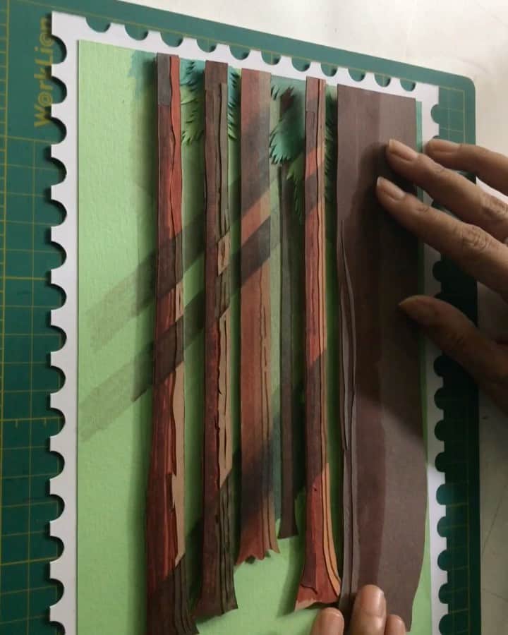 のインスタグラム：「A small process of my current piece. For the first time I have painted the papers in shades I want since there’s a shortage of colours. Learning to adapt to the current situation using the amazing cutting knife by @excelblades  . The forest I’m creating is similar to the forest in Winden @darknetflix  Coincidence or have I got inspired as I see one episode every night in darkness when all are asleep. It’s hard to watch but just impossible to stop ! . 🎶 Theme song from Dark : Goodbye by Apparat」