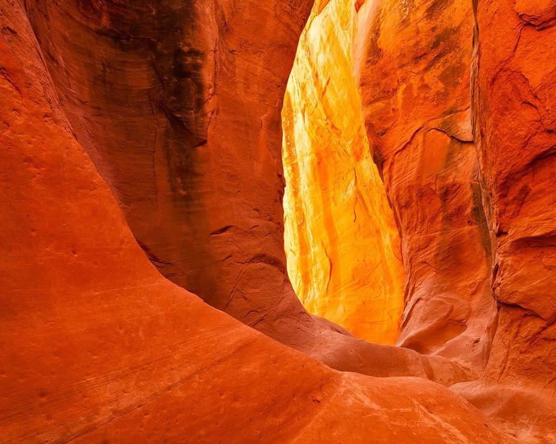 National Geographic Travelさんのインスタグラム写真 - (National Geographic TravelInstagram)「Photo by @stephen_matera  Light and shadows cover a slot canyon in southern Utah. As the sun enters the canyon, bouncing off the sandstone walls, the color of the sandstone saturates in deep oranges and reds. Follow me @stephen_matera for more images like this from Utah and around the world. #desert #slotcanyon #utah」7月12日 17時08分 - natgeotravel