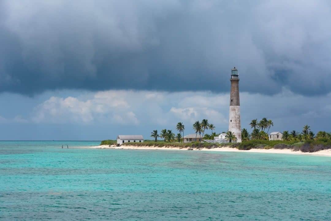 National Geographic Travelさんのインスタグラム写真 - (National Geographic TravelInstagram)「Photo by @CarltonWard  An afternoon storm front blows past the lighthouse at Loggerhead Key in Dry Tortugas National Park. The coral reefs in the shallows here are my favorite in America. This lighthouse marks the farthest land extending from the Florida peninsula and signals to ships transiting from the Atlantic Ocean and Straits of Florida into the Gulf of Mexico. Accessible only by boat and seaplane, with flights and ferries daily from Key West, Dry Tortugas National Park offers fantastic snorkeling and the chance to explore the ruins of historic Fort Jefferson on nearby Garden Key. #DryTortugas #lighthouse #FloridaKeys」7月13日 13時10分 - natgeotravel