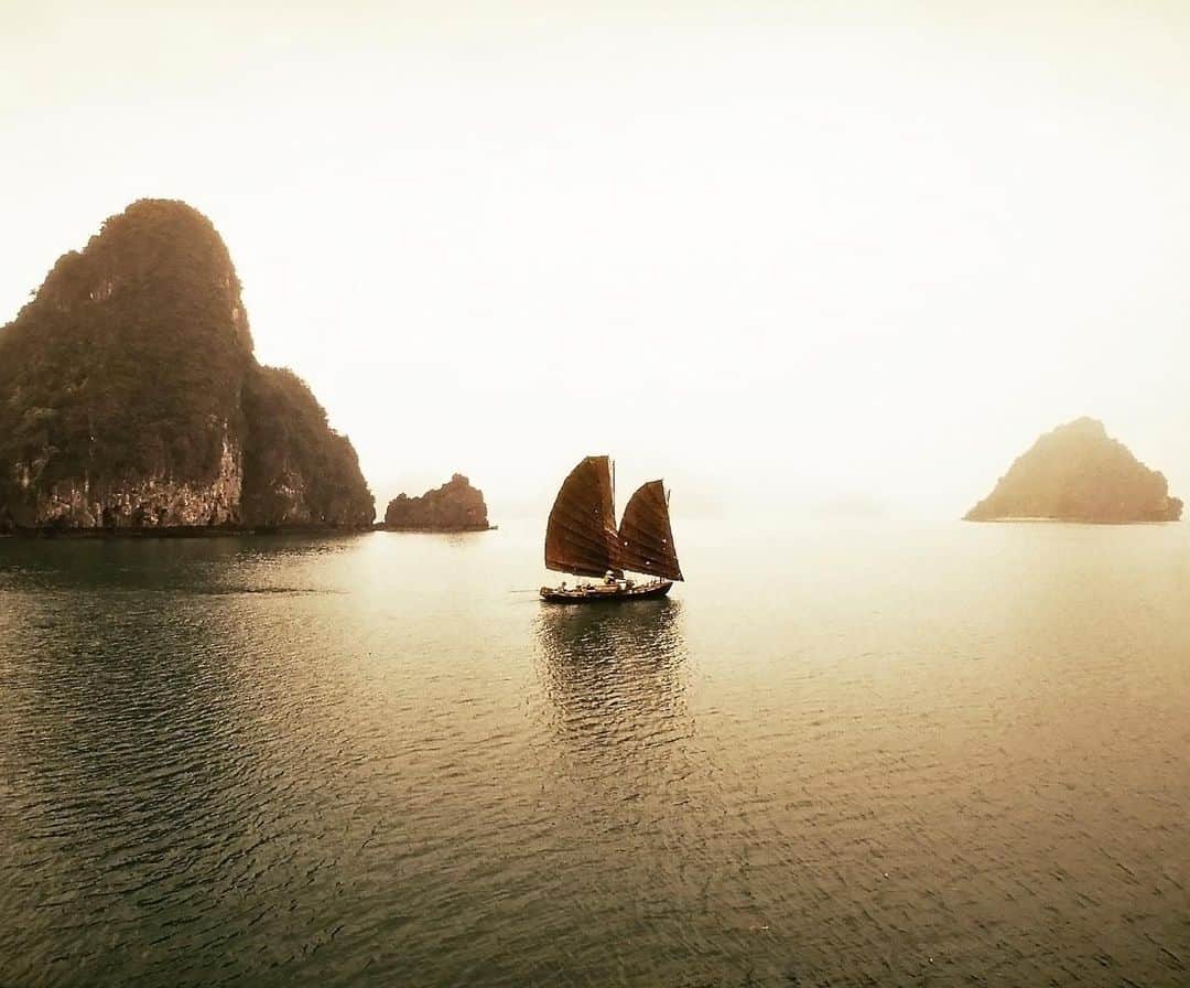 thephotosocietyさんのインスタグラム写真 - (thephotosocietyInstagram)「Photo by @catherinekarnow // A fishing boat plies the waters of Halong Bay, Vietnam. Long been the inspiration for poets and painters, Vietnam's treasure, Halong Bay, is an archipelago of over 3000 islands, made of limestone karsts. The islands, mysteriously sculpted by nature, resemble pyramids, pillars, cones, humans, animals. The locals refer to them as The Fighting Roosters, the Dog, The Turtle. Taken in 1994, this image is a scene you'll never see again. Despite being a UNESCO World Heritage site, Halong Bay has been virtually ruined by badly managed over-tourism, with an excess of tourist boats (painted white!), pollution, poor safety standards and so on. One can only hope that progressive reforms can restore some of the poetry of the place.」7月15日 11時07分 - thephotosociety