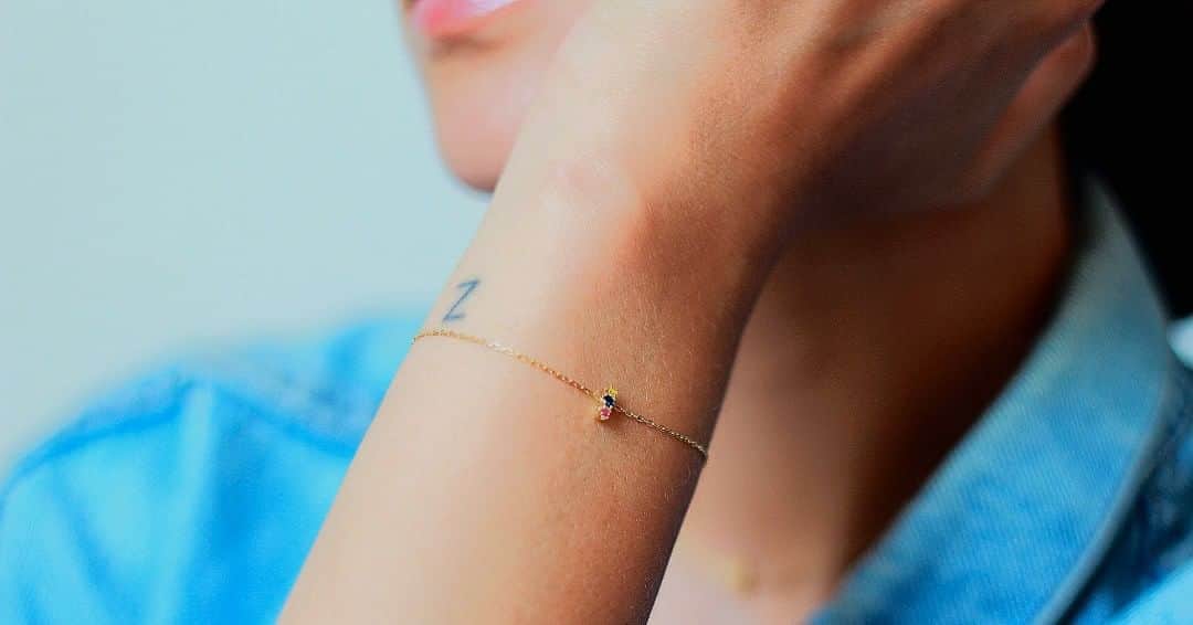 のインスタグラム：「This 18ct yellow bracelet is from our Rainbow collection🌈 Made from diamond cut, fine gold chain with a little bar of set sapphires in yellow, blue and pink, this makes for a perfect bracelet to layer with other fine bracelets and gives a pop of colour.  In support of our LGBTQ+ community we are donating 10% of sales from our Rainbow Collection to local organisation @mosaiclgbtyouth 🏳️‍🌈  📸 @shotbymandy」