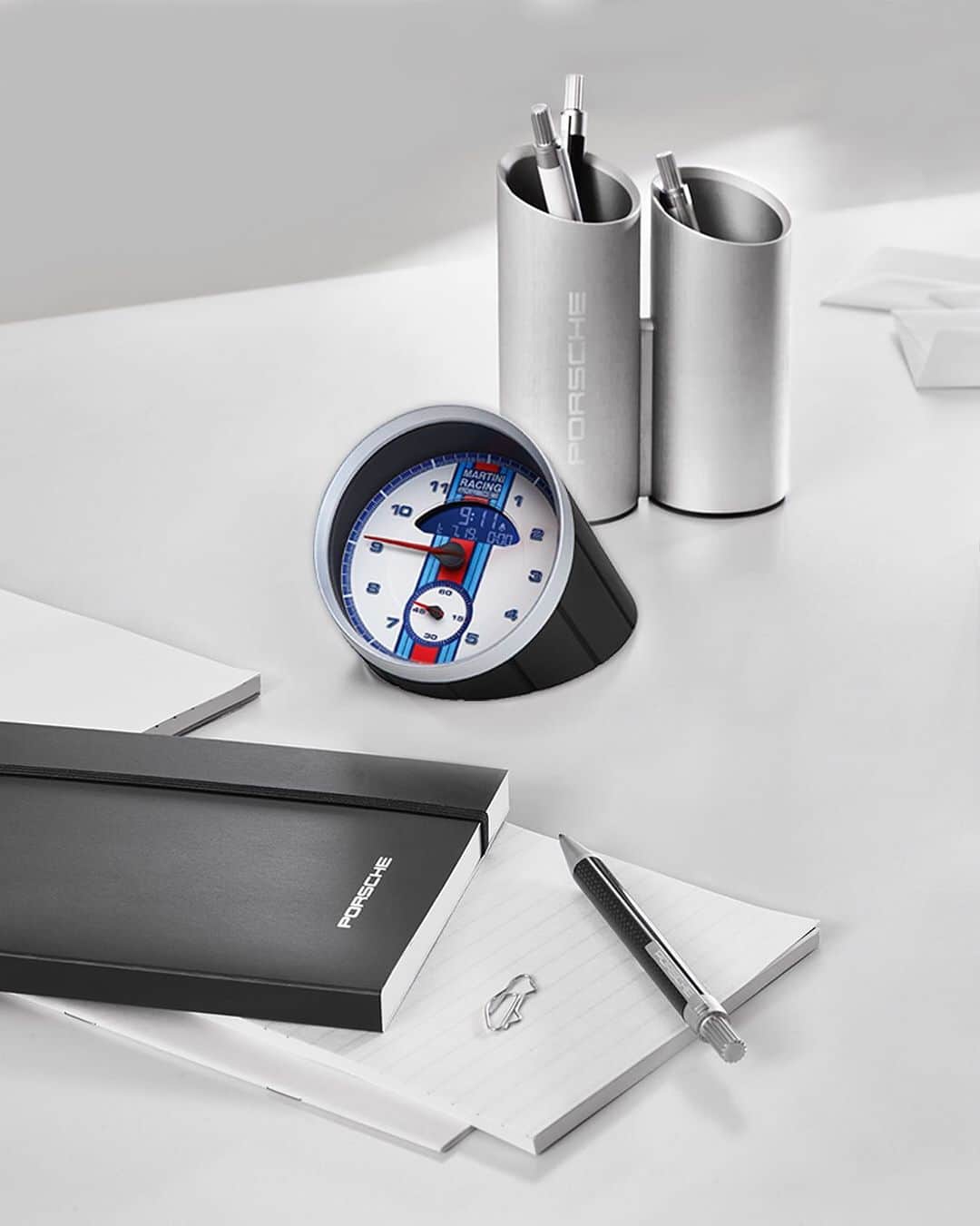 Porscheさんのインスタグラム写真 - (PorscheInstagram)「Time may race, and with the MARTINI RACING® Tabletop Clock, it’s enjoyable to watch.  Now available in the Porsche Online Shop. #Porsche」7月17日 0時46分 - porsche