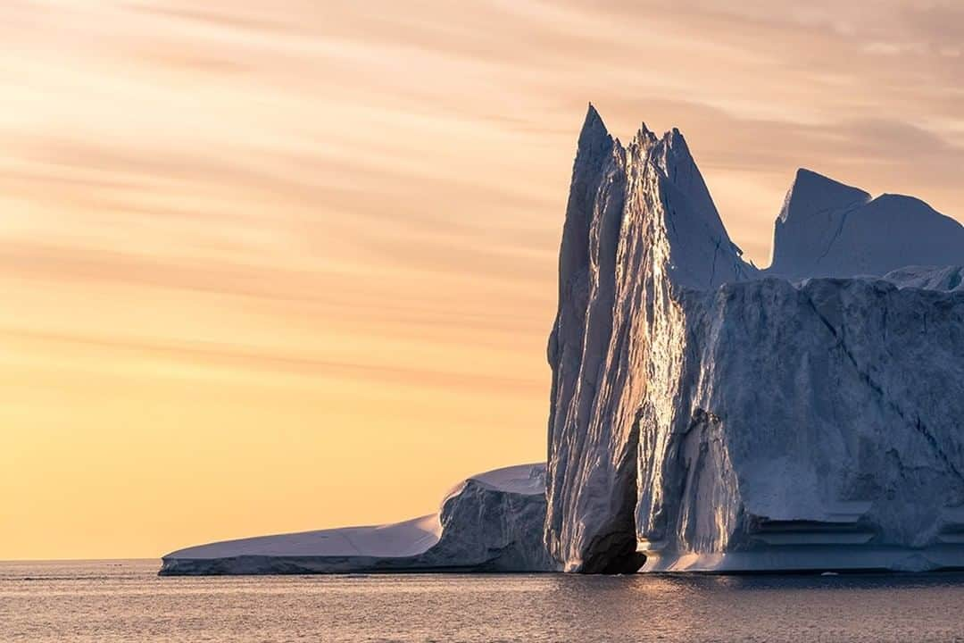 National Geographic Travelさんのインスタグラム写真 - (National Geographic TravelInstagram)「Photo by @daisygilardini  Eastern Greenland's Scoresby Sound is one of the biggest fjord systems in the world. Its main body is 110 kilometers (70 miles) long and spreads out into a series of side fjords and islets that cover some 38,000 square kilometers (15,000 square miles). The large glaciers found all along these fjords produce a massive amount of icebergs that are particularly active, as the system creates its own circular gyre currents. As a result, the icebergs are constantly moving as they're flushed out into open water. #Greenland #icebergs #glaciers #climatechange」7月17日 11時04分 - natgeotravel