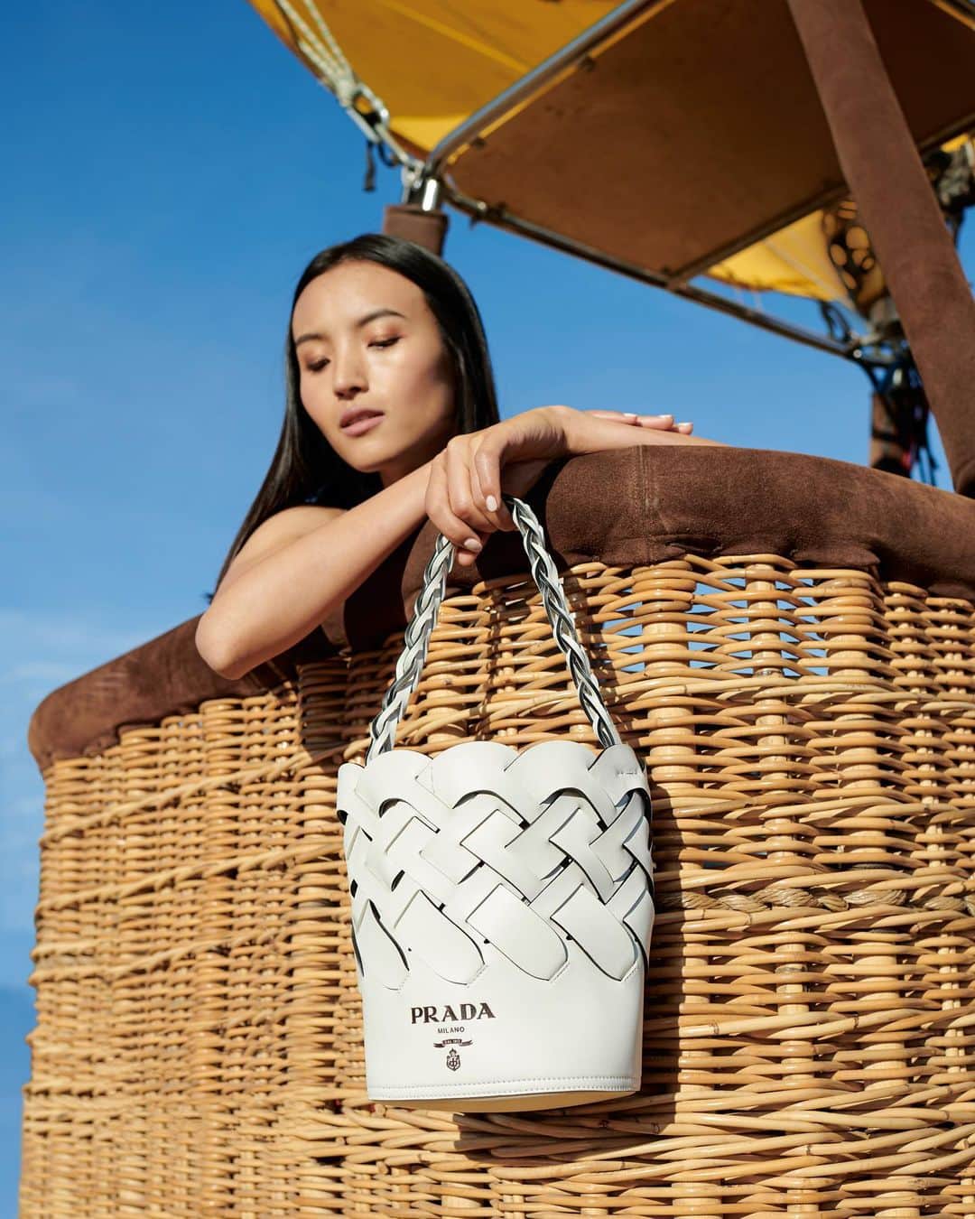 Saks Fifth Avenueさんのインスタグラム写真 - (Saks Fifth AvenueInstagram)「The basket-weave motif has gone through a major style evolution, from hot air balloons to this @prada bucket bag.」7月18日 23時14分 - saks