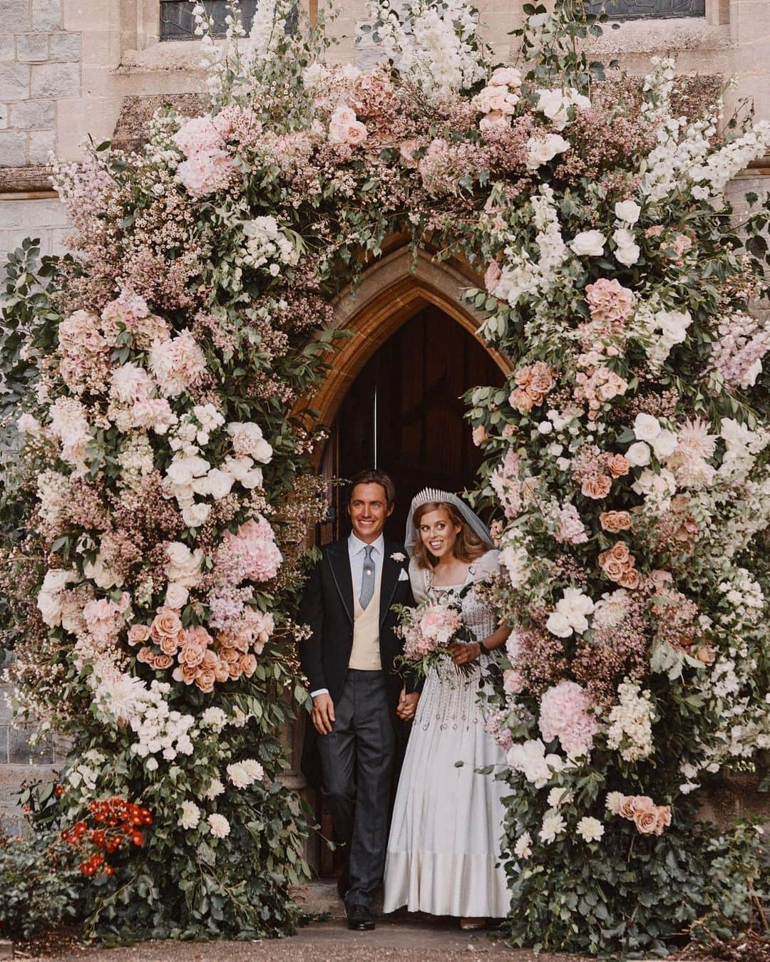 British Vogueさんのインスタグラム写真 - (British VogueInstagram)「Here’s a breathtaking first look at #PrincessBeatrice’s wedding dress, that she wore on Friday morning to marry #EdoardoMapelliMozzi. In a modern and sustainable move, Princess Beatrice chose to wear a vintage #NormanHartnell dress borrowed from the Queen. Made from ivory Peau De Soie taffeta, the diamanté-encrusted gown features organza puff sleeves and is trimmed with Duchess satin. Dipping into her grandmother’s heirlooms, Princess Beatrice completed her look with the Queen Mary tiara – the same diamond fringe piece that the Queen wore to marry the Duke of Edinburgh. See everything you need to know about the #royalwedding now at the link in bio.  Photographed by @BenjaminWheeler.」7月19日 6時00分 - britishvogue