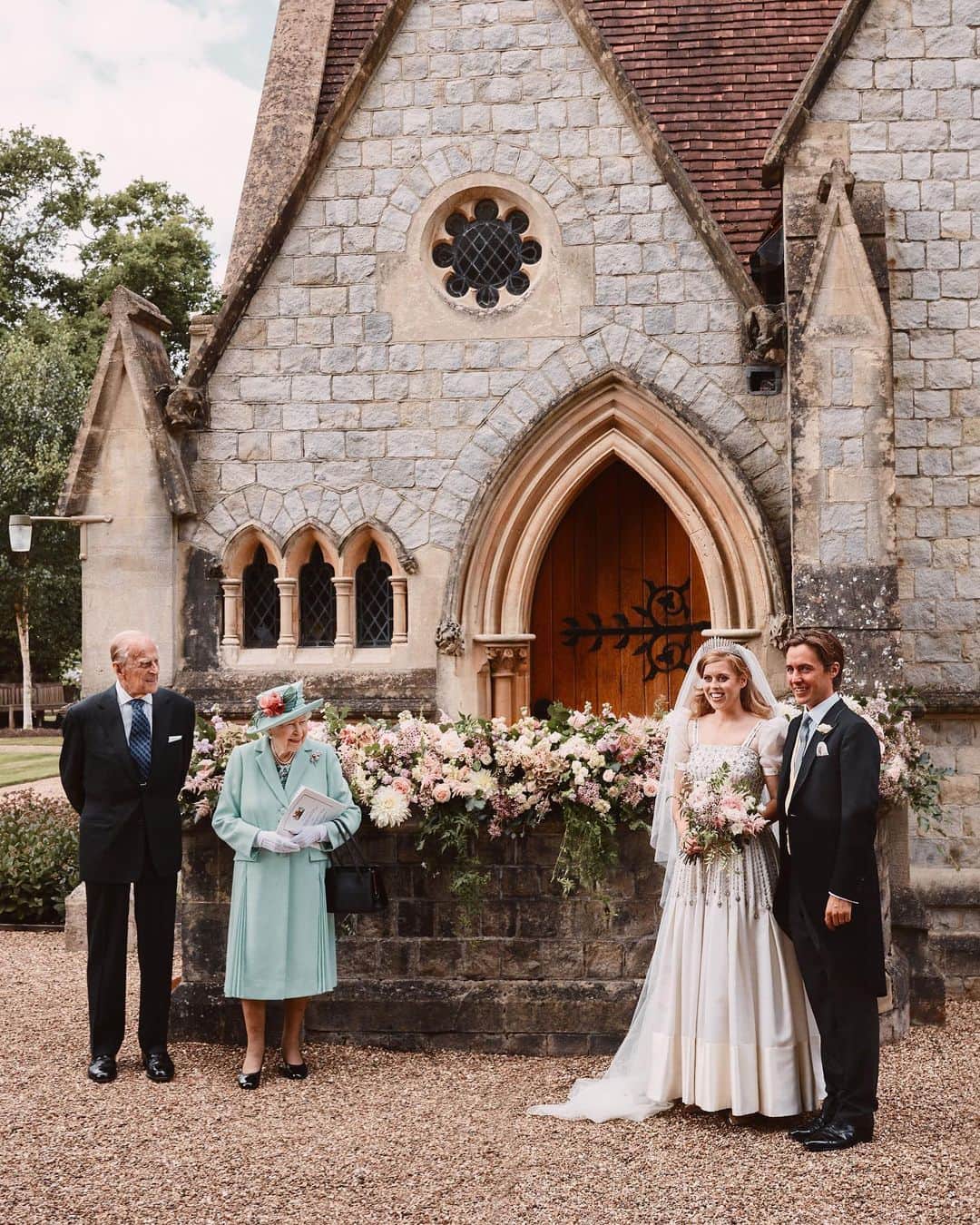 British Vogueさんのインスタグラム写真 - (British VogueInstagram)「Here’s a breathtaking first look at #PrincessBeatrice’s wedding dress, that she wore on Friday morning to marry #EdoardoMapelliMozzi. In a modern and sustainable move, Princess Beatrice chose to wear a vintage #NormanHartnell dress borrowed from the Queen. Made from ivory Peau De Soie taffeta, the diamanté-encrusted gown features organza puff sleeves and is trimmed with Duchess satin. Dipping into her grandmother’s heirlooms, Princess Beatrice completed her look with the Queen Mary tiara – the same diamond fringe piece that the Queen wore to marry the Duke of Edinburgh. See everything you need to know about the #royalwedding now at the link in bio.  Photographed by @BenjaminWheeler.」7月19日 6時00分 - britishvogue