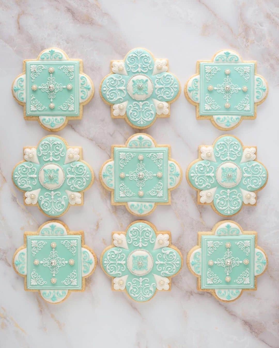 KUNIKAのインスタグラム：「Tiffany blue tile cookies 🧚﻿ ﻿ ティファニーブルー×白×アラザンのタイルクッキー﻿ オリジナルの型で作りました🌜﻿ ﻿ #artofkunika #kunicookie」