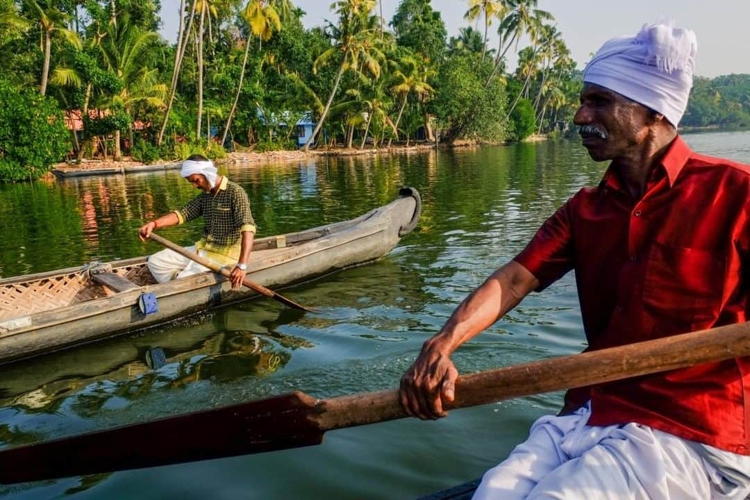 National Geographic Travelさんのインスタグラム写真 - (National Geographic TravelInstagram)「Photo by @francescolastrucci  Early in the morning, two men paddle on their traditional rowboats in Kerala. They are floating in front of the lush banks in a branch of the Ashtamudi Lake, one of the biggest in India and the gateway to one of the best backwater routes in the region.  Meaning “eight cones” in the local Malayalam language because of its topography and its eight branches resembling a palm tree, Ashtamudi Lake is known for its unique wetland system and rich biodiversity. I photographed a series of images of the backwaters immersed in a dreamlike environment: the colors of the fist daylight, the mirroring placid waters, and the echoes of the chants coming from the surrounding temples.  Follow me @francescolastrucci for more places, daily life, and stories around the world. #india #kerala #backwaters」8月16日 7時03分 - natgeotravel