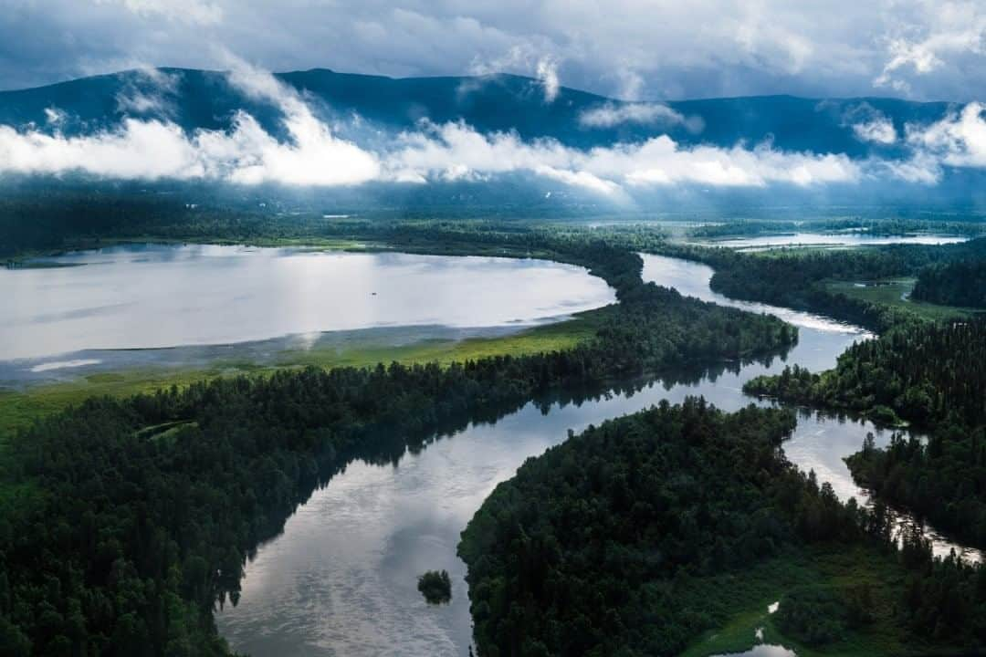 National Geographic Travelさんのインスタグラム写真 - (National Geographic TravelInstagram)「Photo by @MartinEdstrom  This little mountainous township of Kvikkjokk, Sweden, has seen so many changes over the years—and still does. Back in the 17th century only Sámi people lived here, until prospectors found silver in the mountains. This resulted in a big expansion, with people moving in from the south of Sweden to capitalize on the minerals. But the silver trade never turned a profit and slowly died down. A quiet time without much investment and expansion followed.⁠ ⁠Today Kvikkjokk is still a hub for the Sámi communities working in the traditional reindeer trade. It has also become a major tourism destination at the end of the road—a place where people jump off a bus or park their car to head into the mountains. ⁠⁠I've been here many times, heading into the Padjelanta or Sarek National Parks, but I have never seen it look as beautiful as it did on this July morning from a helicopter. Follow @MartinEdstrom for more images and stories from Sweden and the Nordics. #exploringhome #sweden #padjelanta #sarek #nordics」8月16日 9時05分 - natgeotravel