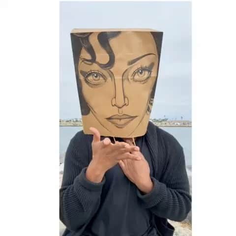デヴィッド・ギルモアのインスタグラム：「Happy birthday @madonna! 👑 My plus 1 wearing a paper bag I painted with her royal likeness, referencing a photo I’d found on her makeup artist @visionaaron page.  #strikeapose #theresnothingtoit #vogue  #madonna」