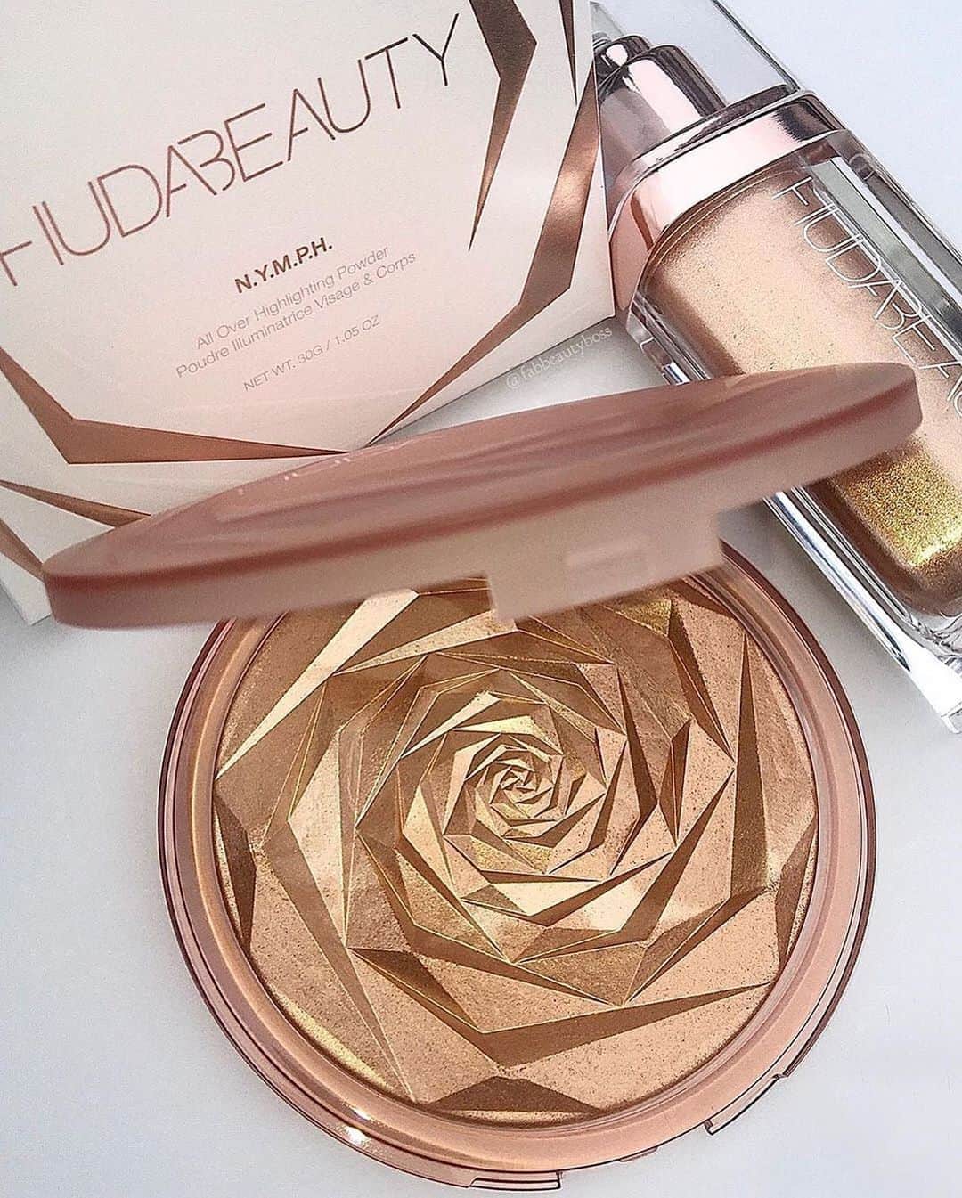 Huda Kattanさんのインスタグラム写真 - (Huda KattanInstagram)「SO happy you love it my love!! 🤗🤗🤗 repost @fabbeautyboss ⁣The New N.Y.M.P.H All Over Body Highlighter Powder!  ⠀⠀⠀⠀⠀⠀⠀⠀⠀ First of all I want to say how super impressed I am with Hudabeautyshop and her team. I ordered this on the day of the launch which was on Wednesday and got it by Friday. Super quick!  ⠀⠀⠀⠀⠀⠀⠀⠀⠀ I couldn’t wait to open it and WOW I fell in love. It’s the most stunning Highlighter 🤩 In love with the packaging and Rose design highlighter powder, Super HUGE Pan size, formula is so beautiful, highlighter powder that blends beautifully on the skin, Gorgeous pearl shimmer and gives an amazing warm bronze glow that’s buildable.  Swatches are coming up!  Definitely must have highlighter✨  ⠀⠀⠀⠀⠀⠀⠀⠀⠀ It’s available exclusively on HudaBeauty.com」7月27日 0時20分 - hudabeauty