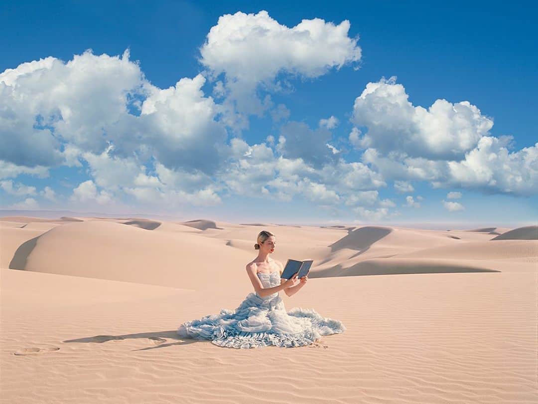 タイラー・シールズのインスタグラム：「Even though I walked miles through the sand drove miles to the lab waited days for my scans the moment I released the shutter I knew the photo would be exactly what I wanted it to be. It’s like time speeds up and slows down at the same time. I love making photographs, but there is something special about going the extra mile, challenging yourself, make the photos that make you happy and make photos that you love not just photos that will get likes.  This is a new work of mine titled Blue Book from my Fairytale series this was shot on film on my trusty @hasselblad camera. The tone the colors and the feel will make this such an incredible print which I can not wait to see where it ends up. Which room in your house would you hang this in?」