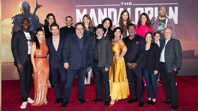 のインスタグラム：「Here’s a shot from the premiere of @themandalorian; it includes only a few of the incredibly dedicated and talented people whose work earned the show FIFTEEN #Emmy nods including #BestDrama.  The love I feel for the show and the collaborators who made it happen just gets bigger and warmer and fuzzier. * The other nominations: Outstanding Character Voice-Over Performance (@taikawaititi), Production Design for Narrative Program (half-hour), Cinematography for Single Camera (half hour), Fantasy/sci-fi costumes, 3 single-camera Picture editing for a drama series, Prosthetic make-up, music composition (@ludwiggoransson), a guest actor in a drama series nod for @thegiancarloesposito , 2 sound-editing in a comedy/drama half hour series, outstanding special vfx, and stunt coordination for a drama series (@ryan_watson74 ), limited series or movie. * Thanks to all the incredible fans who love and support the show! * #THISISTHEWAY * @starwars @disney @disneyplus」