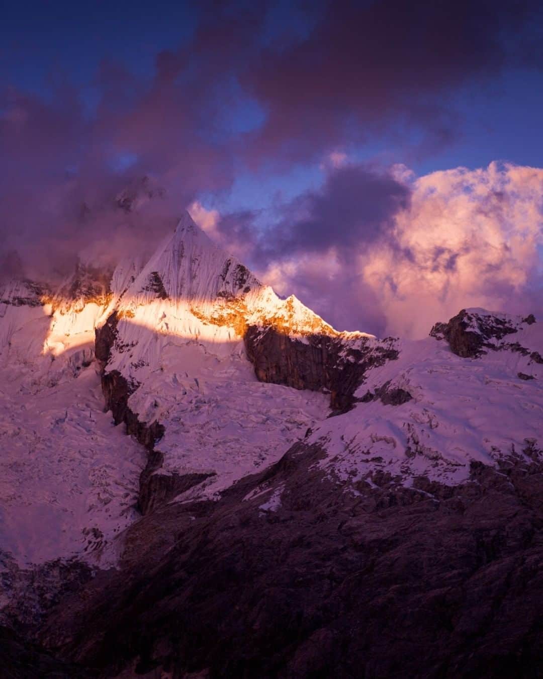 National Geographic Travelさんのインスタグラム写真 - (National Geographic TravelInstagram)「Photo by @emilypolar  Last light shines on Ranrapalca through a sliver of clouds. This was taken just before our preclimb nap at Vallunaraju base camp in the Cordillera Blanca of Peru. To see more of Peru and beyond, follow me @emilypolar. #Peru #CordilleraBlanca #Andes」7月29日 21時07分 - natgeotravel