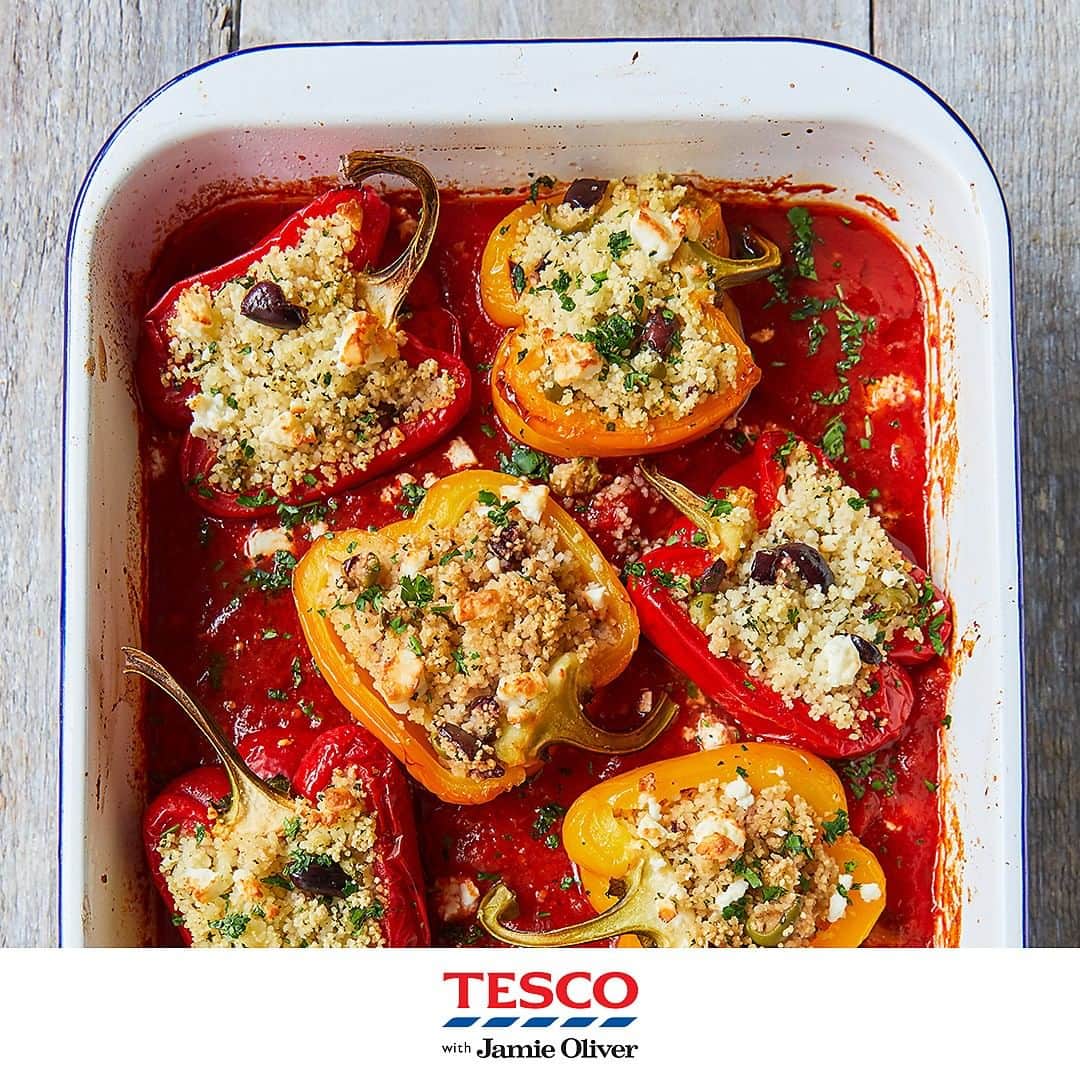 Tesco Food Officialさんのインスタグラム写真 - (Tesco Food OfficialInstagram)「A dish to light up your summer evenings, courtesy of @JamieOliver. These perfectly packed peppers are a vibrant and easy way to #EatMoreVeg. #TescoAndJamie  Ingredients 4 mixed-colour peppers 4 garlic cloves olive oil 75g mixed-colour olives, stone in 150g couscous 1 lemon bunch of flat-leaf parsley (30g) extra virgin olive oil 2 x 400g tins quality plum tomatoes 1 heaped tbsp rose harissa 50g feta natural yogurt, to serve (optional)  Method 1. Preheat the oven to gas 4, 180°C, fan 160°C. Halve and deseed the peppers and bash the unpeeled garlic cloves. Put it all in a large roasting tin, drizzle with 1 tbsp oil and season with sea salt and black pepper. Roast for 30 mins, or until tender.  2. Meanwhile, squash, destone and roughly chop the olives, then put them in a large bowl with the couscous. Add a good grating of lemon zest and squeeze in half the juice. Pick half the parsley leaves and set aside for later, then finely chop the rest, stalks and all, and add to the bowl. Add 1 tbsp extra virgin olive oil and pour over enough boiling water to just cover the couscous. Cover with a plate and leave to stand for 5 mins.  3. Remove the tin from the oven and move the peppers to a plate for a moment. Squeeze the soft garlic flesh into the tin, discarding the skins, then add the tomatoes and harissa. Crush it all with a potato masher and season to perfection.  4. Fluff up the couscous with a fork, then divide and spoon into the softened peppers. Sit the peppers in the sauce, crumble over the feta, then return the tin to the oven for a further 30 mins, or until the sauce is thick and reduced and the peppers are soft and sweet.  5. Squeeze over the remaining lemon juice, chop and sprinkle over the reserved parsley leaves and serve with a dollop of yogurt, if you like.」7月30日 21時00分 - tescofood