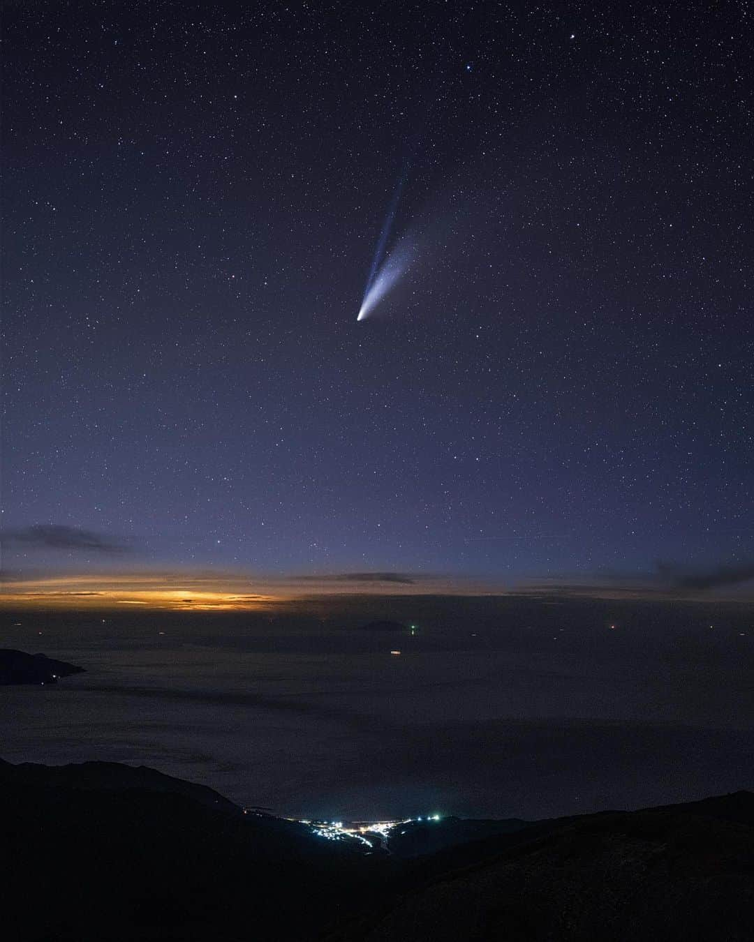 Ryoyaのインスタグラム：「Have you seen comet neowise? Everyone can see it with your naked eye👀  Camera #GFX100 Lens #GF45mm Star tracker #ioptronskyguiderpro  Place // At the top of Mt. Nagatadake  Sky ISO3200 // 45mm // f2.8 // ss40” 4 images tracked & stacked Foreground ISO3200 // 45mm // f2.8 // ss40”  #Japan #Yakushima #nagatadake #comet #neowise #屋久島 #永田岳山頂 #ネオワイズ彗星 #星空」