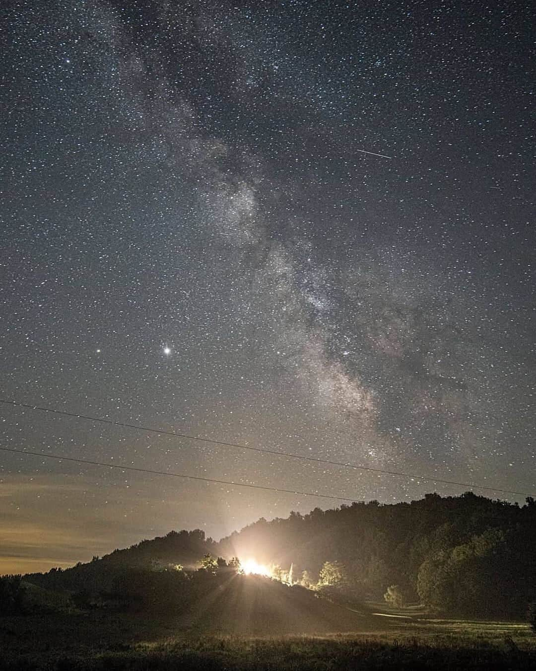 Ricoh Imagingさんのインスタグラム写真 - (Ricoh ImagingInstagram)「Posted @withregram • @frankleeruggles Neowise decided to hide behind some low clouds tonight, so I went to the North End of the Ranch and trained my 25mm lens to the Southeast.   Here's the Milky Way, Jupiter, Saturn and a Shooting Star over the Lincoln Lodge, a layer of fog at ground scattering the cabin lights as Stanley waits in the window for me to return.   He's a good boy.  #Neowise #MilkyWay @shenandoahnps  #neowisecomet  #neowisec2020f3 #astrophotography #ig_astrophotography #nightphotography #nightsky #Pentax645Z @ricohpentax @ricohusa  #shenandoahnationalpark #shenandoah #instaphoto  #landscapephotography #shootingstar #meteorshower  #nationalparkgeek  @nationalparkservice  #virgina  @nationalparktrust @usinterior #earth_shotz #NPGeekAmbassador #optoutside #nationalparkgeek #jupiter #saturn  #outdoorphotomag  #national_park_phototography #pentax645ambassador  @ricohusa  #mediumformat  #Ricoh #Pentax」8月1日 5時36分 - ricohpentax