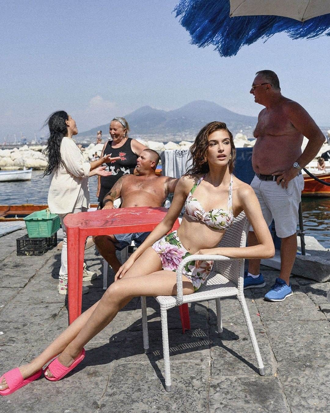ドルチェ&ガッバーナさんのインスタグラム写真 - (ドルチェ&ガッバーナInstagram)「Summer in Napoli, Italia. The #DGSS20 look with a floral print bikini top and bottom, fluorescent fuchsia sliders with the #DolceGabbana logo and #DGEyewear.   Shot by @ciropipoli    #DGWomen #DGLovesNapoli #MadeInItaly🇮🇹」8月3日 4時00分 - dolcegabbana
