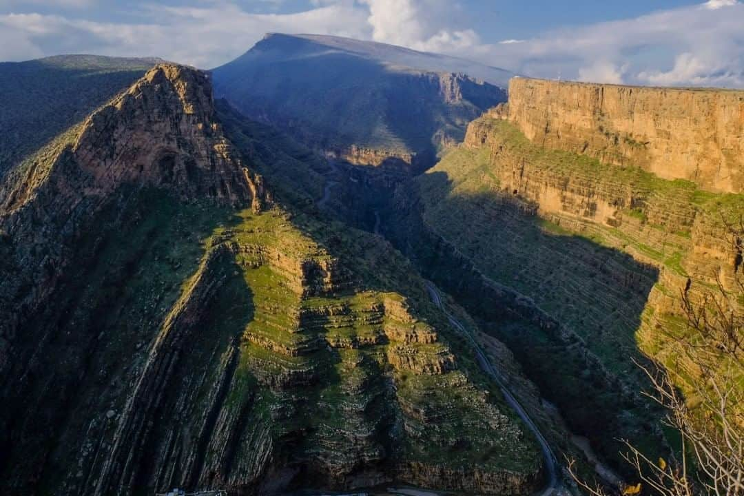 National Geographic Travelさんのインスタグラム写真 - (National Geographic TravelInstagram)「Photo by @francescolastrucci  While traveling on the wild mountain roads of northern Iraq, a few hours' drive north of the Kurdish city of Erbil and close to the town of Rawanduz, I stopped my car to climb and photograph the beautiful, unspoiled mountains surrounding the deep Gali Ali Beg canyon.  The majestic landscape made of rugged mountains and high waterfalls is a great spot for excursions and hikes.  The river snakes its way through the high cliffs of the canyon and along the Hamilton Road, which can be seen in the bottom. Built between 1928 and 1932 by the New Zealand engineer A.M. Hamilton, this spectacular drive that runs between the narrow canyons in the region was made to connect Iraqi Kurdistan with northwest Iran. Besides its strategic purpose, it was made with the hope of uniting the peoples of the neighboring regions. Follow me @francescolastrucci for more places, daily life, and stories around the world. #mountains #kurdish #landscape」8月17日 21時07分 - natgeotravel