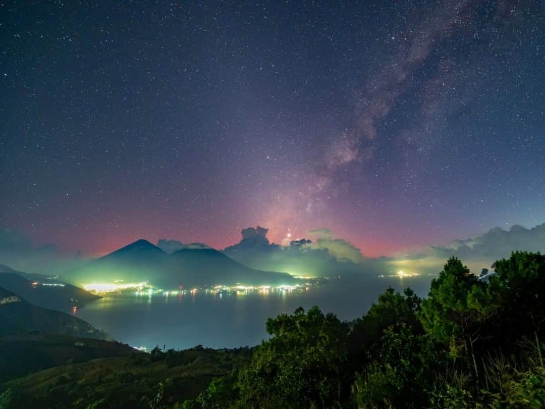 National Geographic Travelさんのインスタグラム写真 - (National Geographic TravelInstagram)「Photo by @babaktafreshi  An impressive November evening from a high-altitude vista of Lake Atitlan, a deep caldera surrounded by Maya communities and volcanoes in Guatemala. The diffuse band of light near the middle is zodiacal light, the reflecting sunlight from asteroid dust in the solar system, only visible far from large cities. Where the last colors of twilight merge with the setting Milky Way, right on top of the clouds, bright planets Venus and Jupiter are in conjunction.  Explore the beauties and wonders of night with me @babaktafreshi. #lakeatitlan #guatemala #volcano #twanight」8月3日 15時03分 - natgeotravel